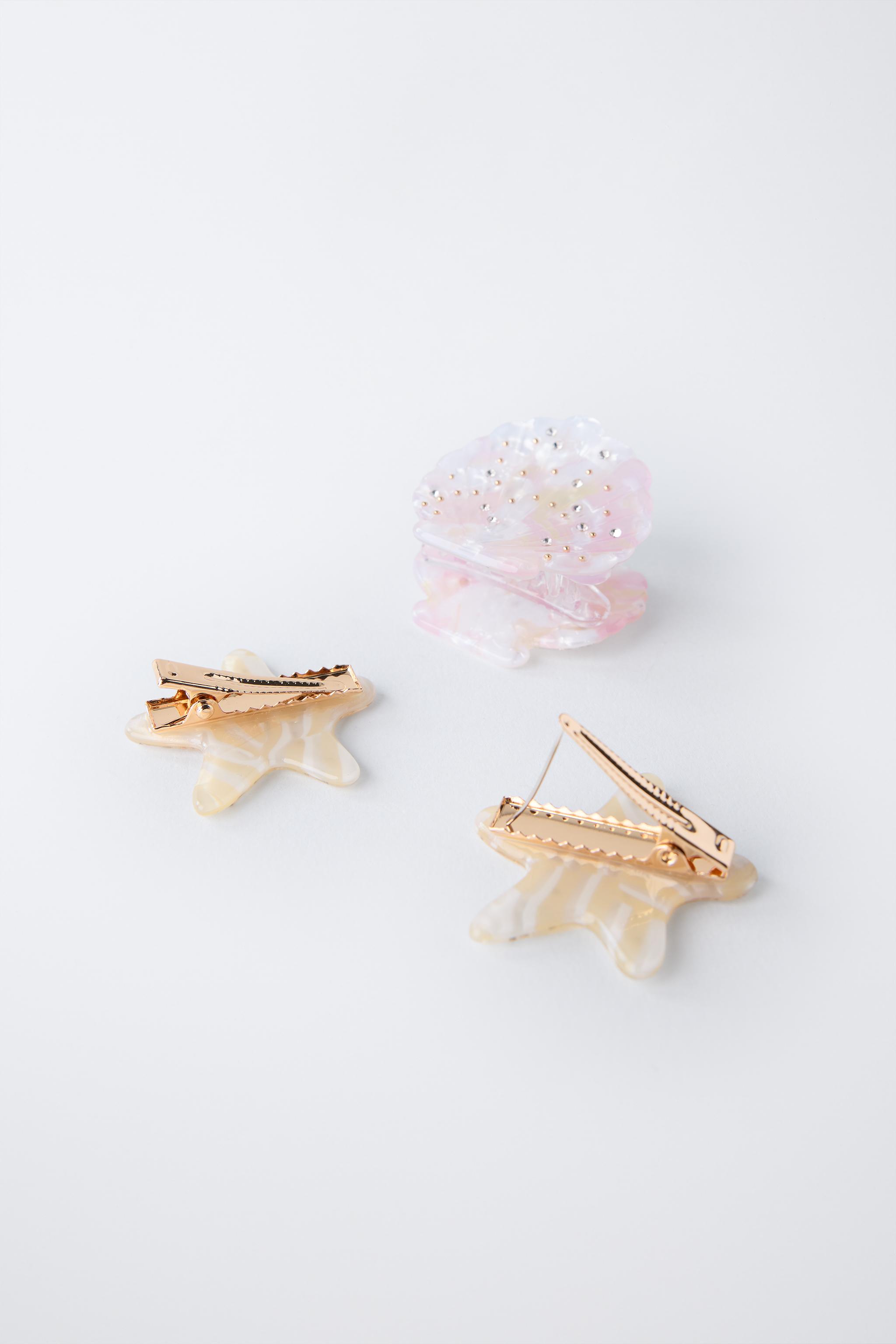 THREE-PACK OF SHELL AND STAR HAIR CLIPS