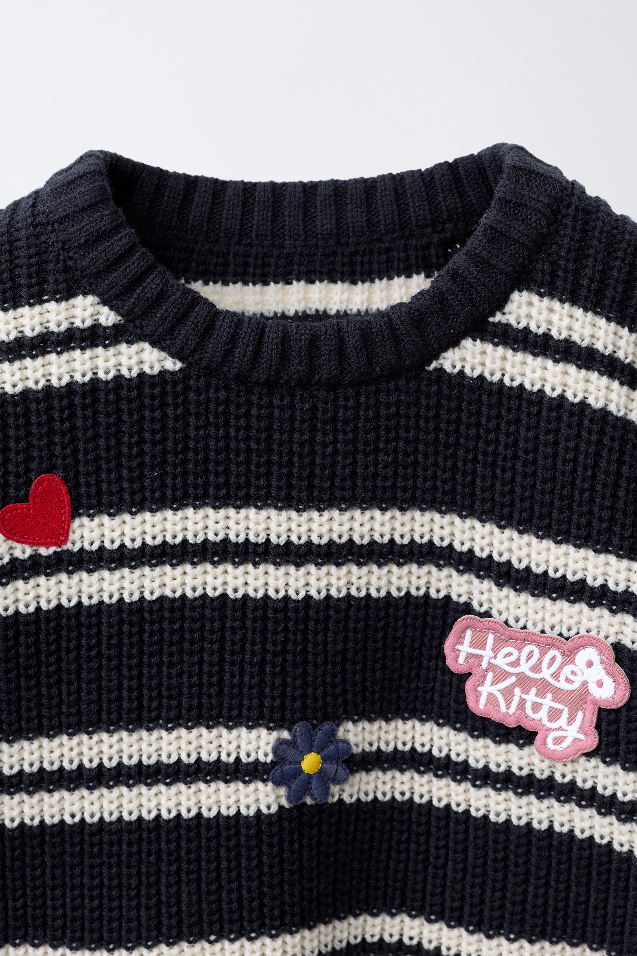 STRIPED KNIT HELLO KITTY © SANRIO PATCH SWEATER