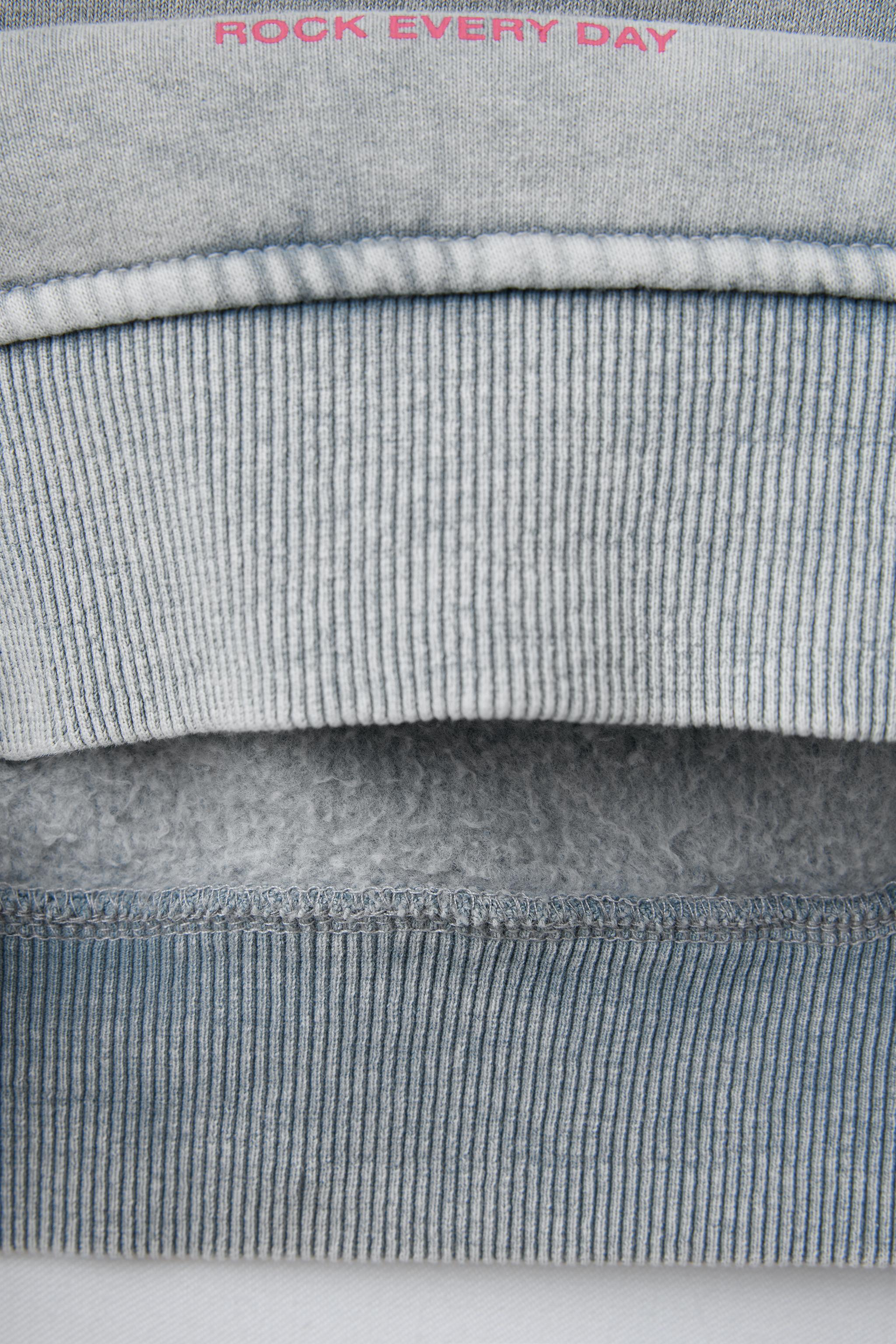 WASHED EFFECT GLITTER STAR SWEATSHIRT