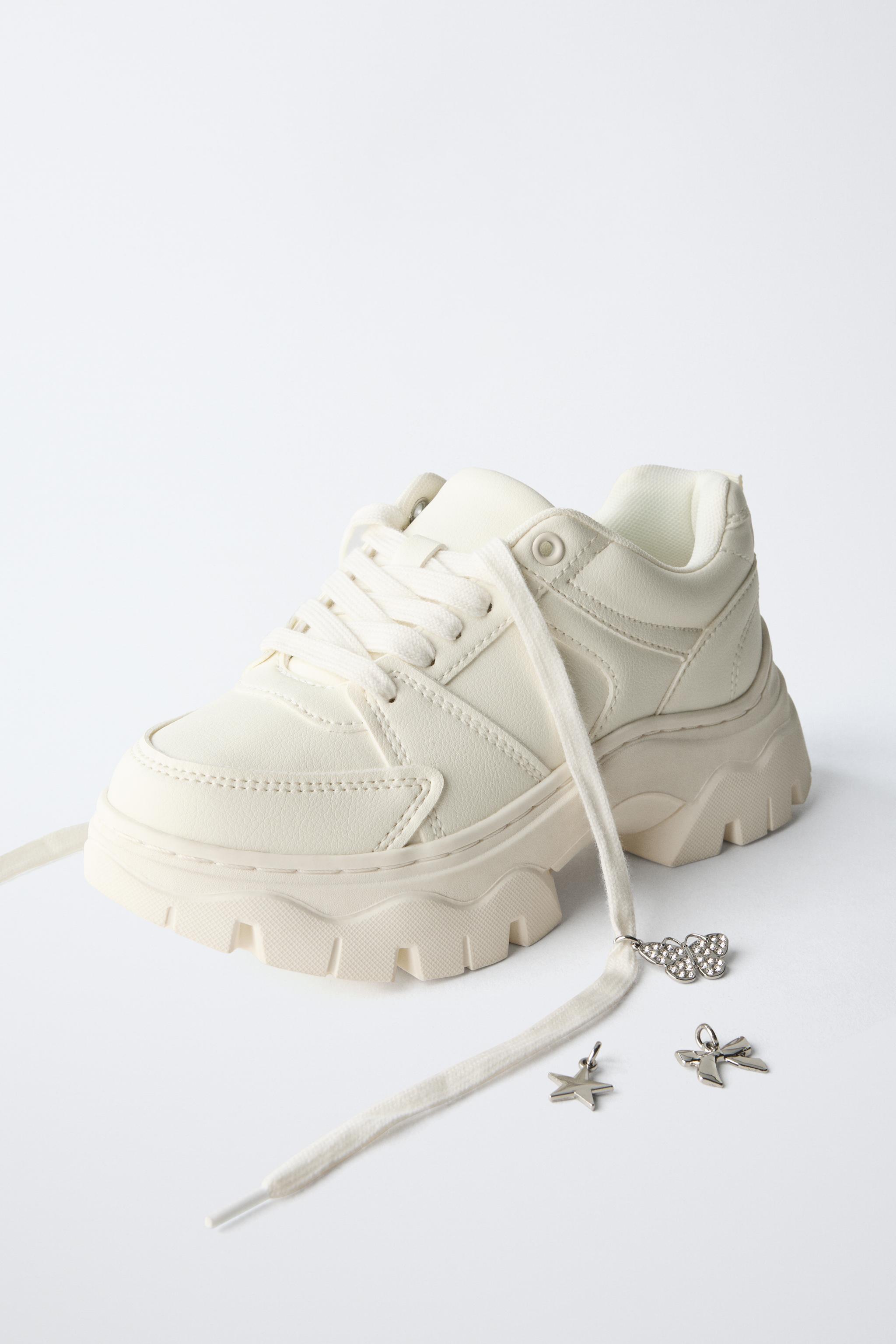 THICK-SOLED SNEAKERS WITH CHARMS