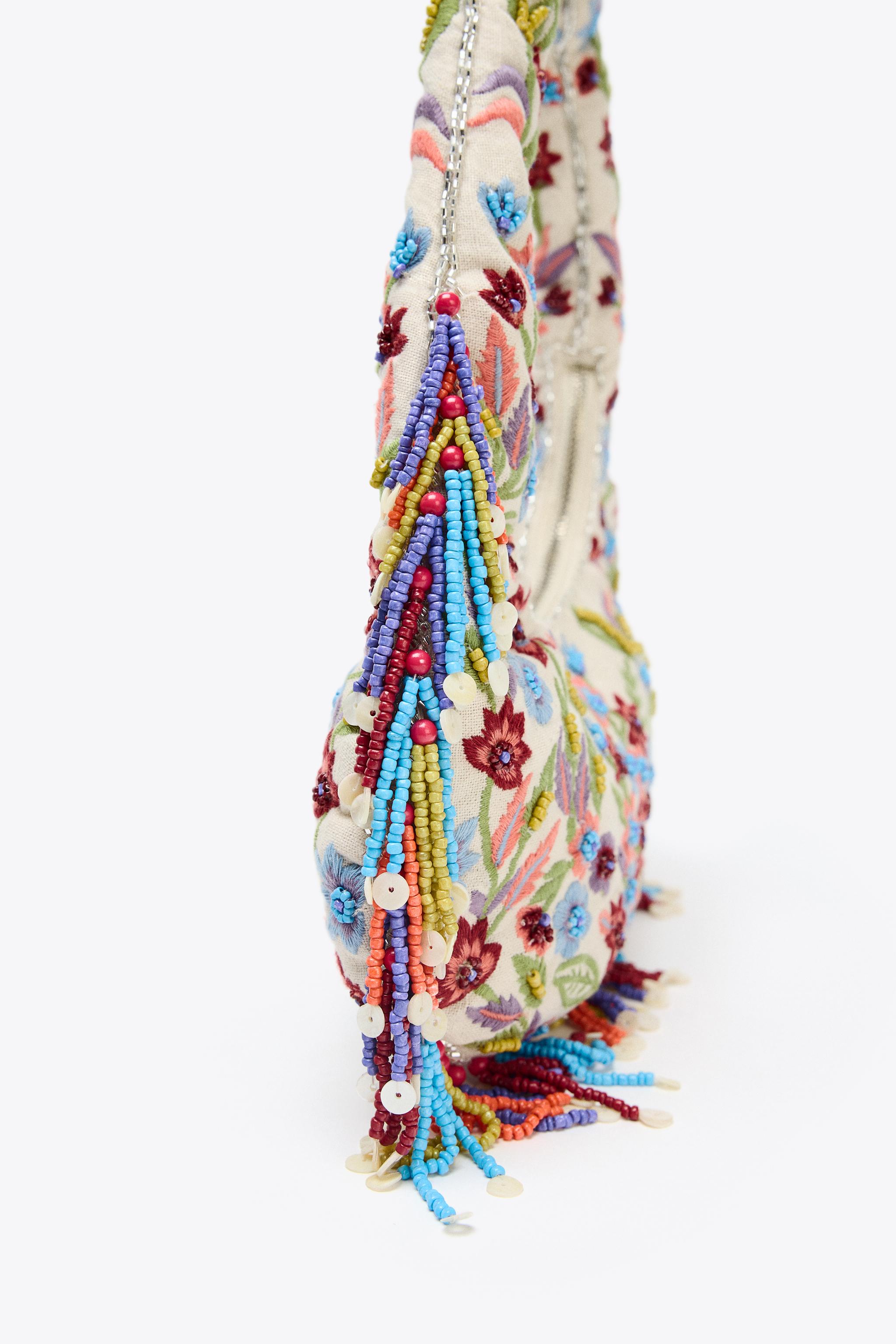 OVAL BAG WITH FLORAL EMBROIDERY