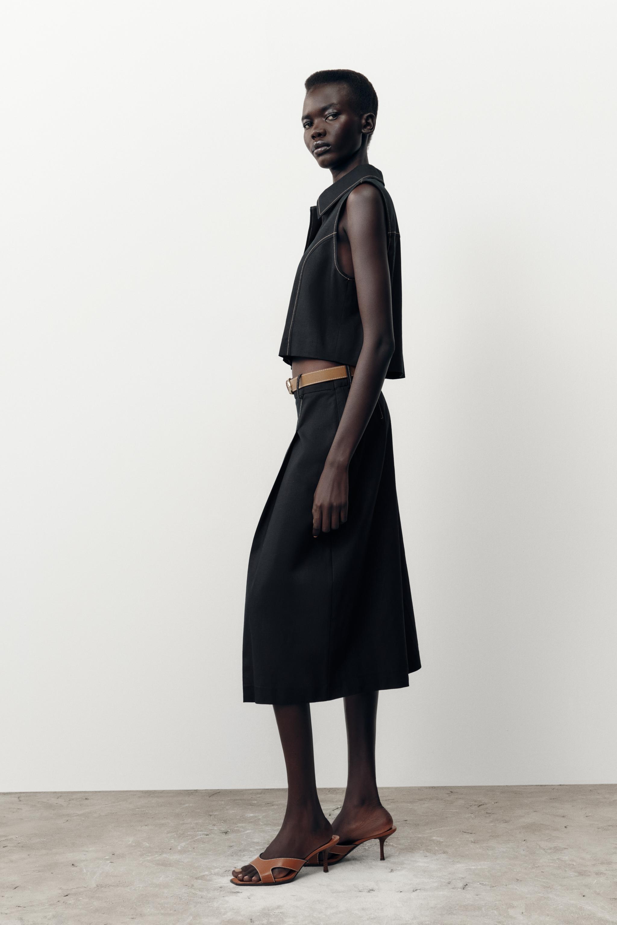 BELTED LONG PLEATED SHORTS