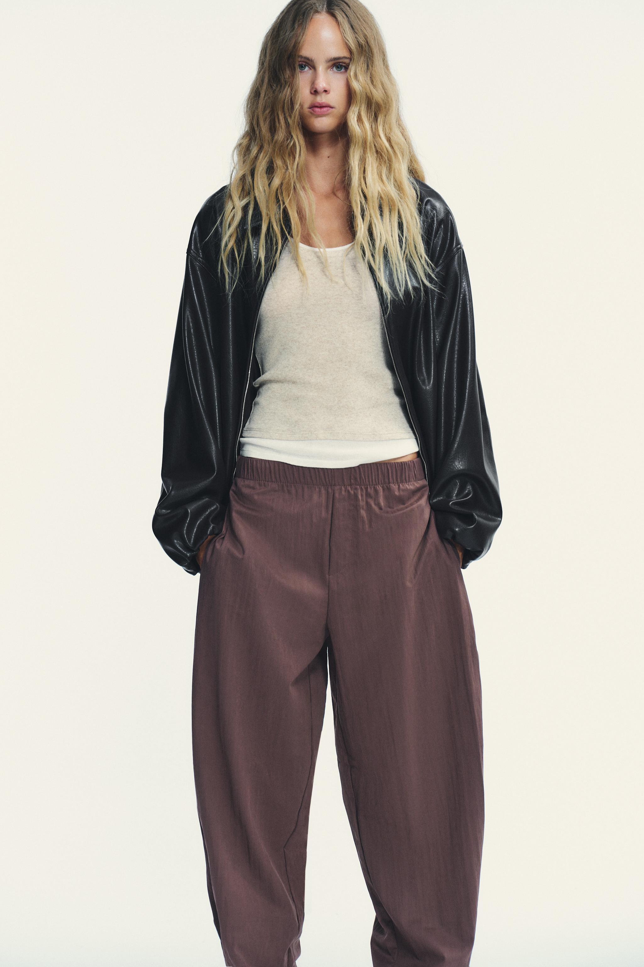 NYLON PANTS WITH BUTTON HEM