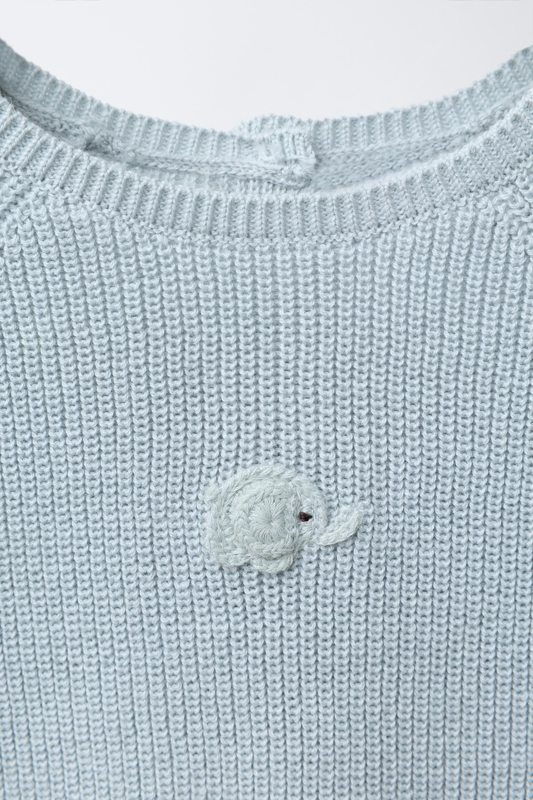 EMBROIDERED ELEPHANT PURL KNIT SWEATER