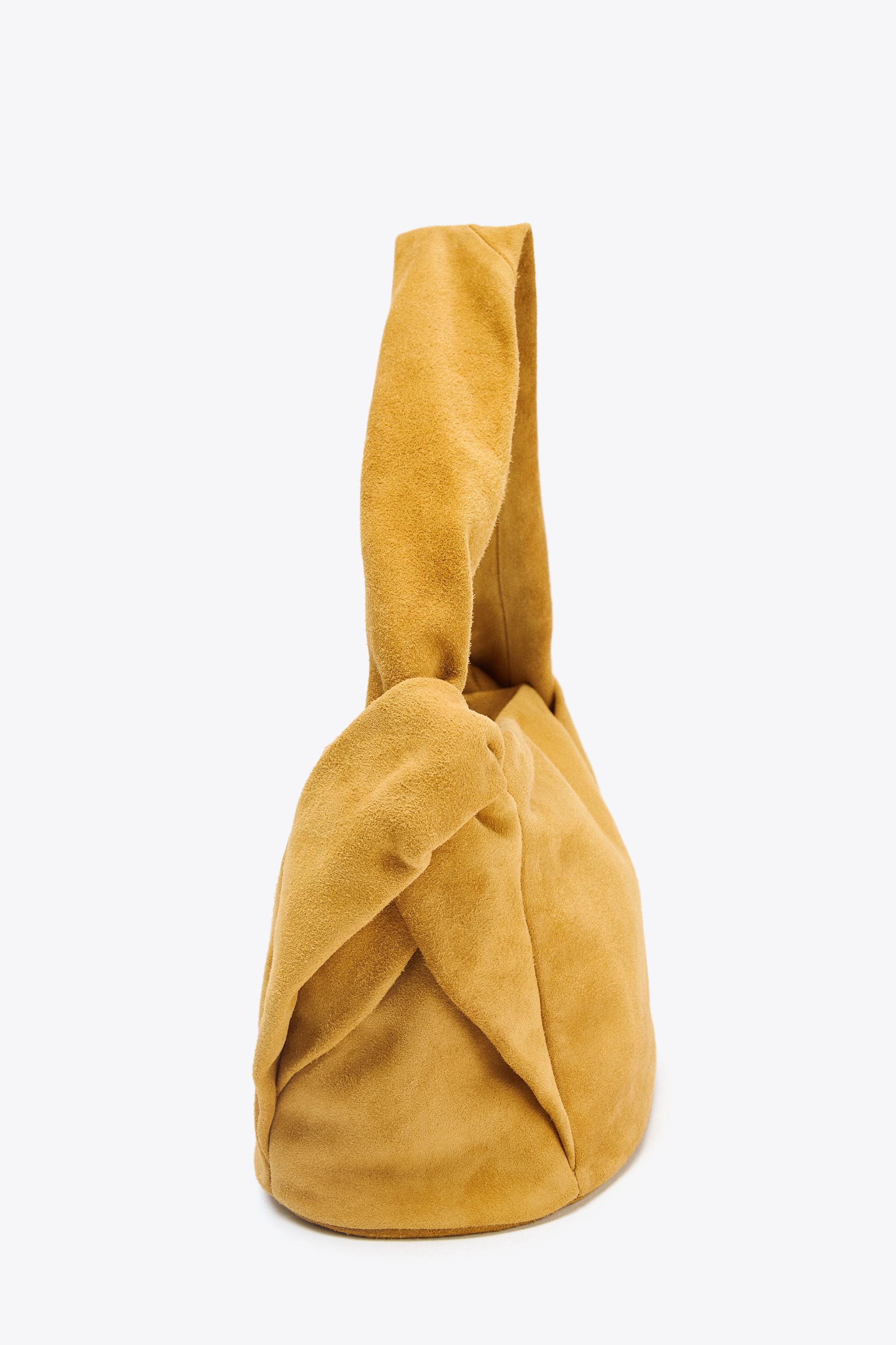 SPLIT LEATHER HANDBAG