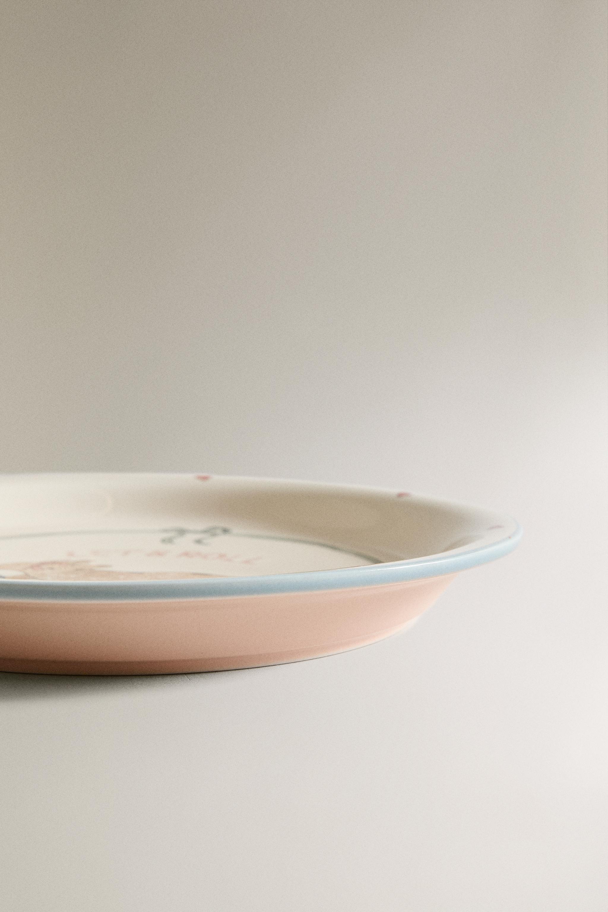 CHILDREN'S CERAMIC SKATING DOG PLATE