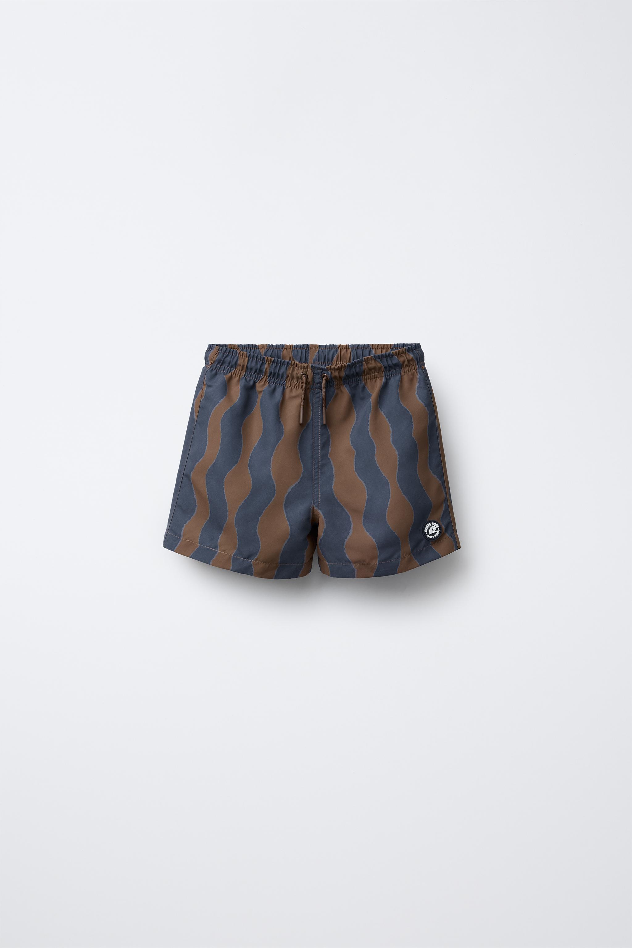 6-14 YEARS/ WAVE PRINT SWIM SHORTS