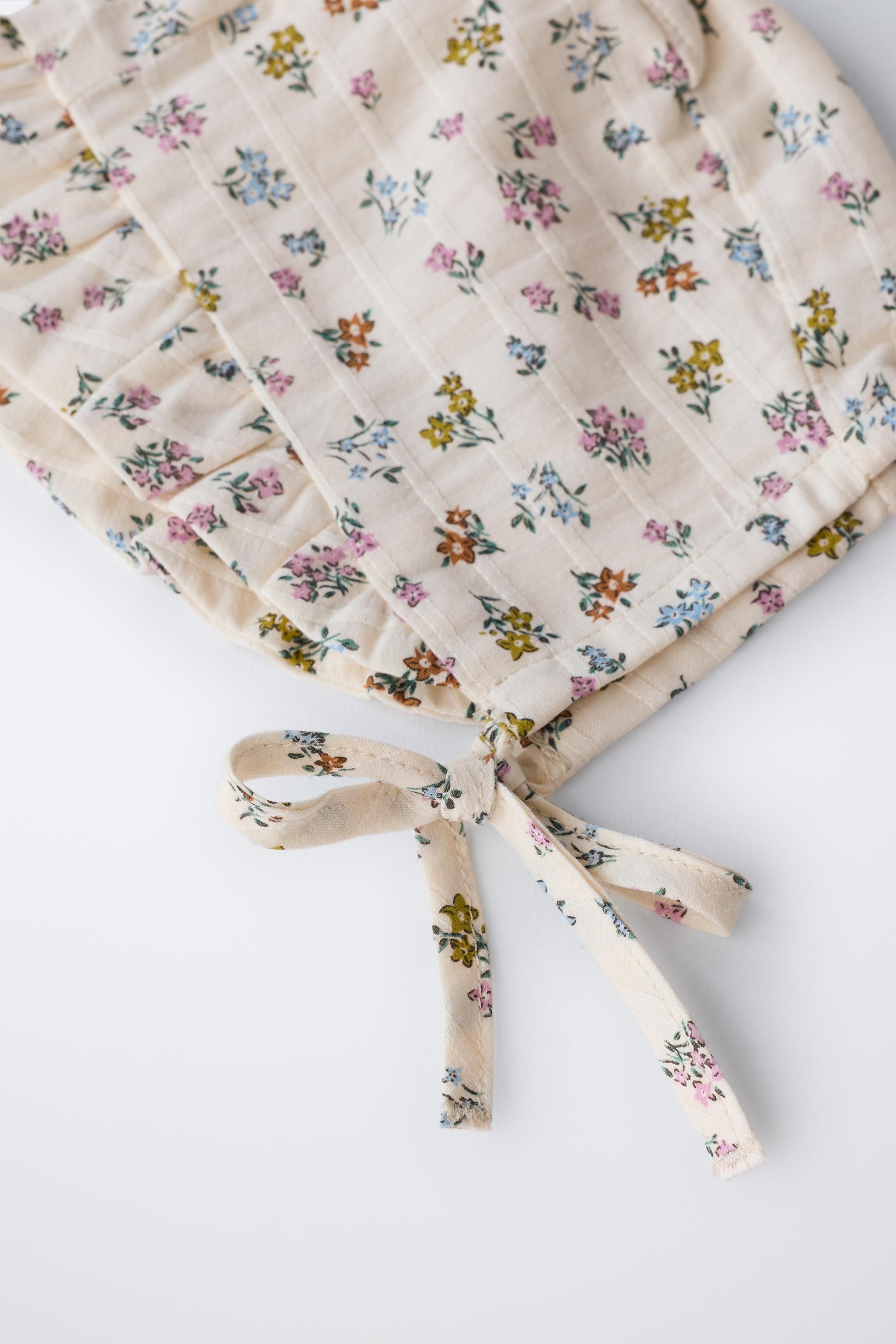 FLORAL TEXTURED RUFFLED BONNET