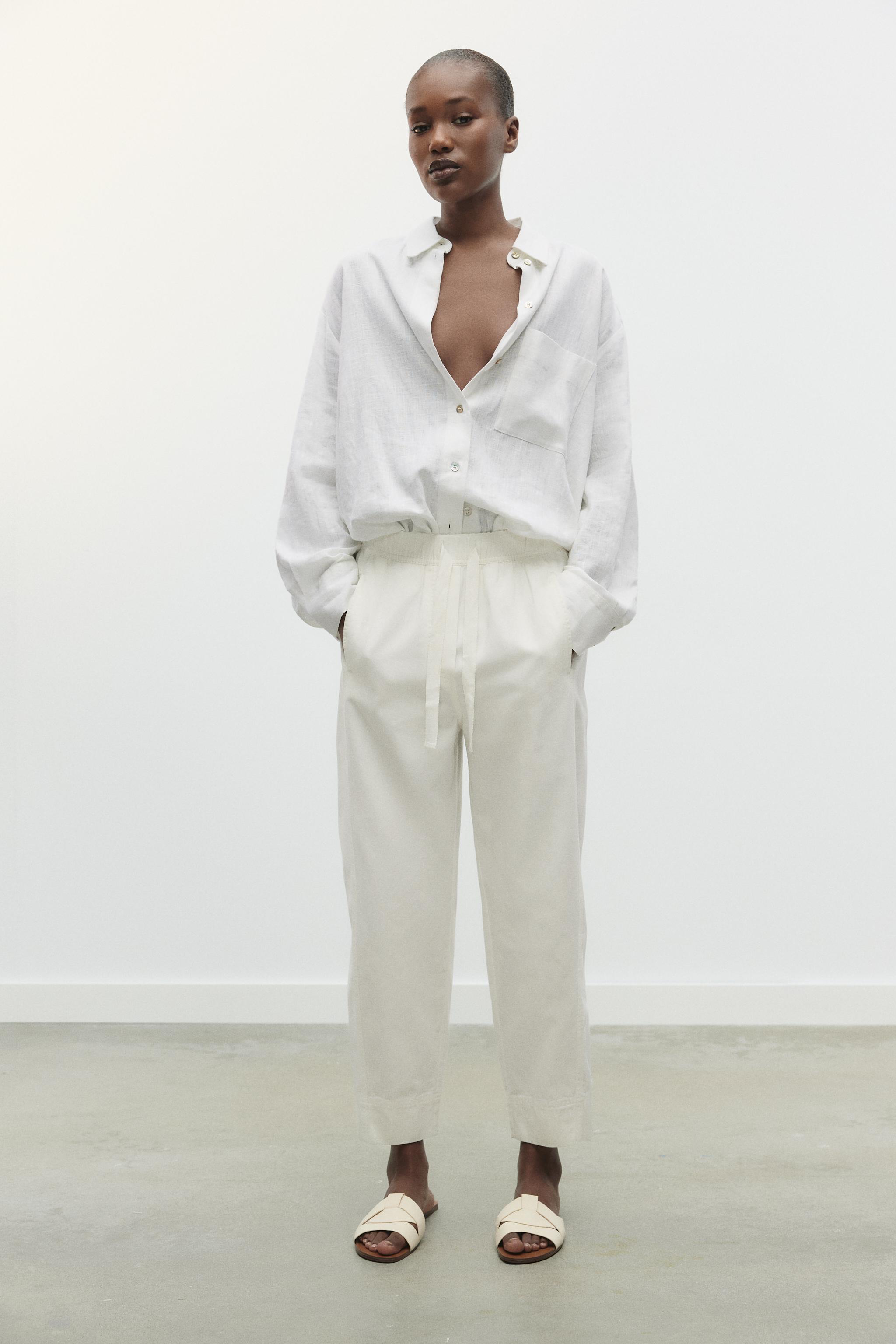 FLAT CROSSED LEATHER SANDALS