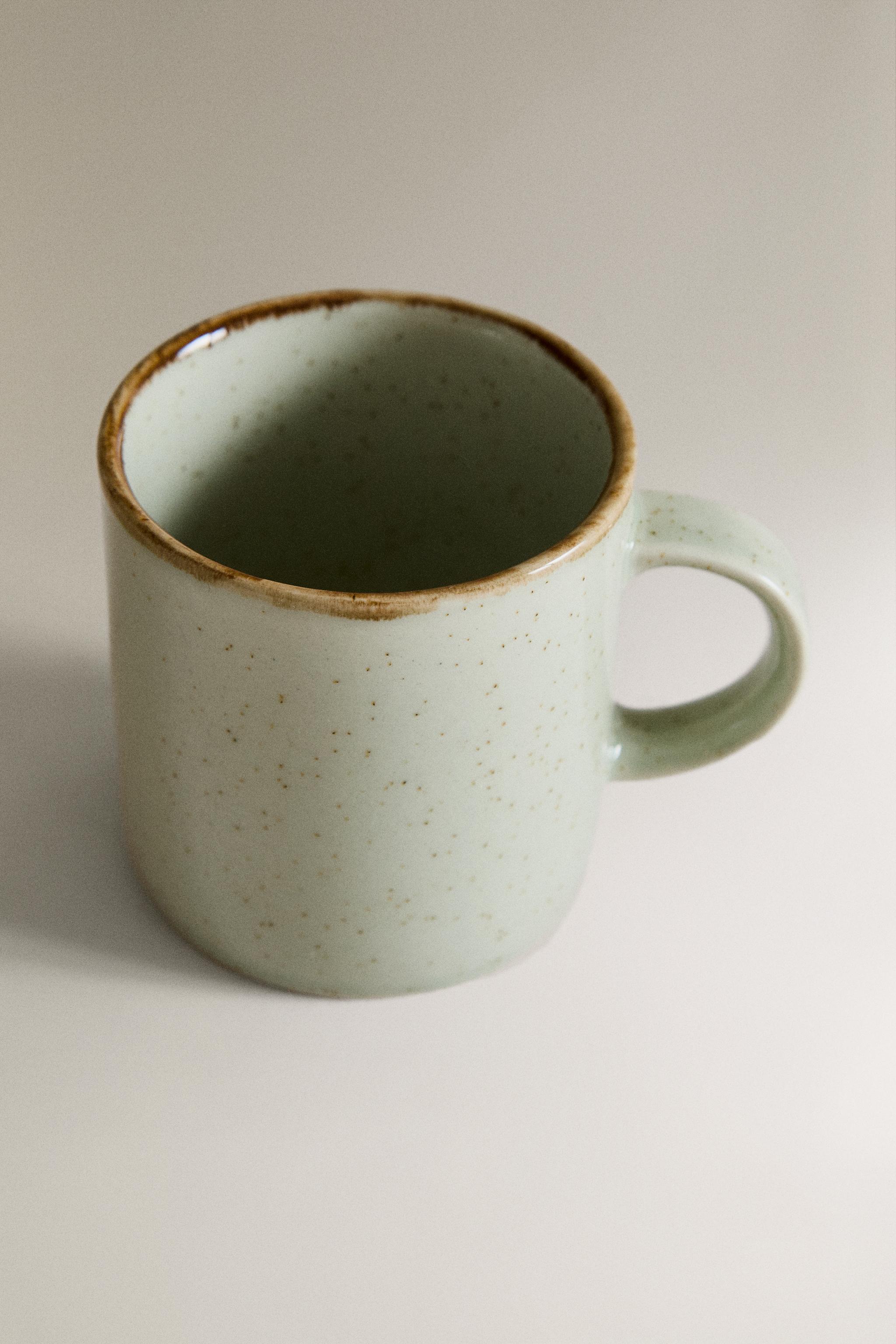 PORCELAIN MUG WITH ANTIQUE FINISH RIM