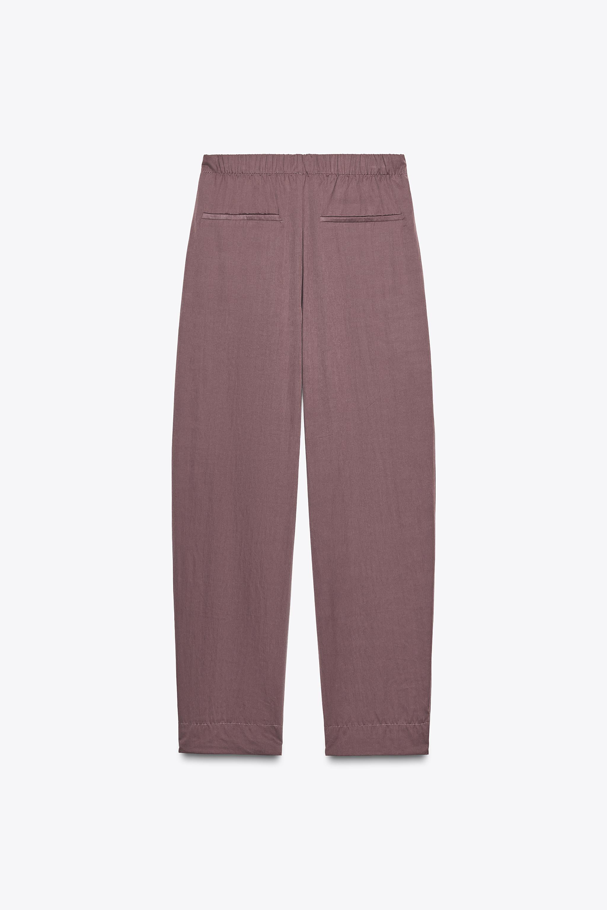 NYLON PANTS WITH BUTTON HEM