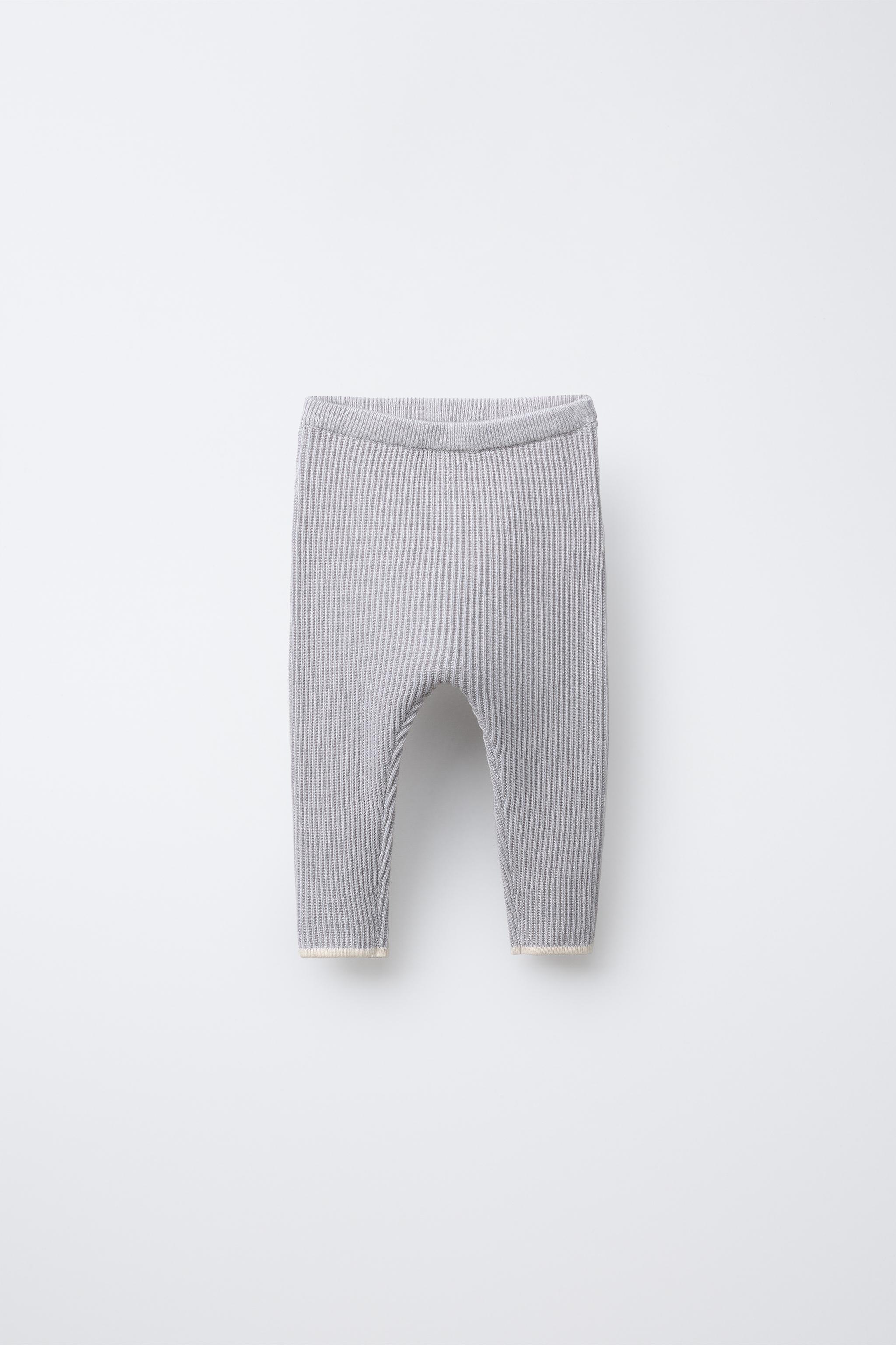 PANTS WITH CONTRASTING PIPING