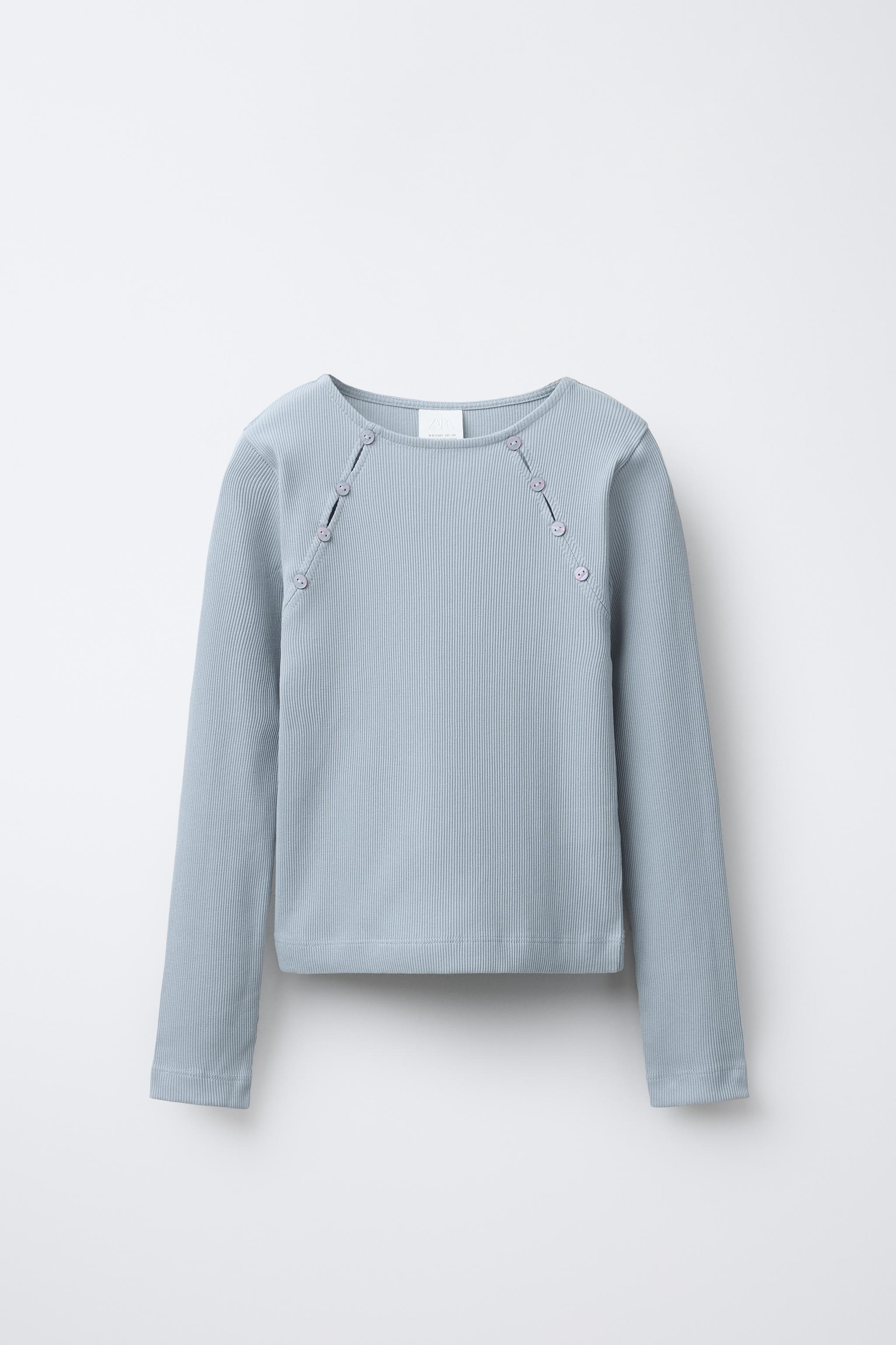 RIBBED T-SHIRT WITH BUTTONS AND CUT-OUT