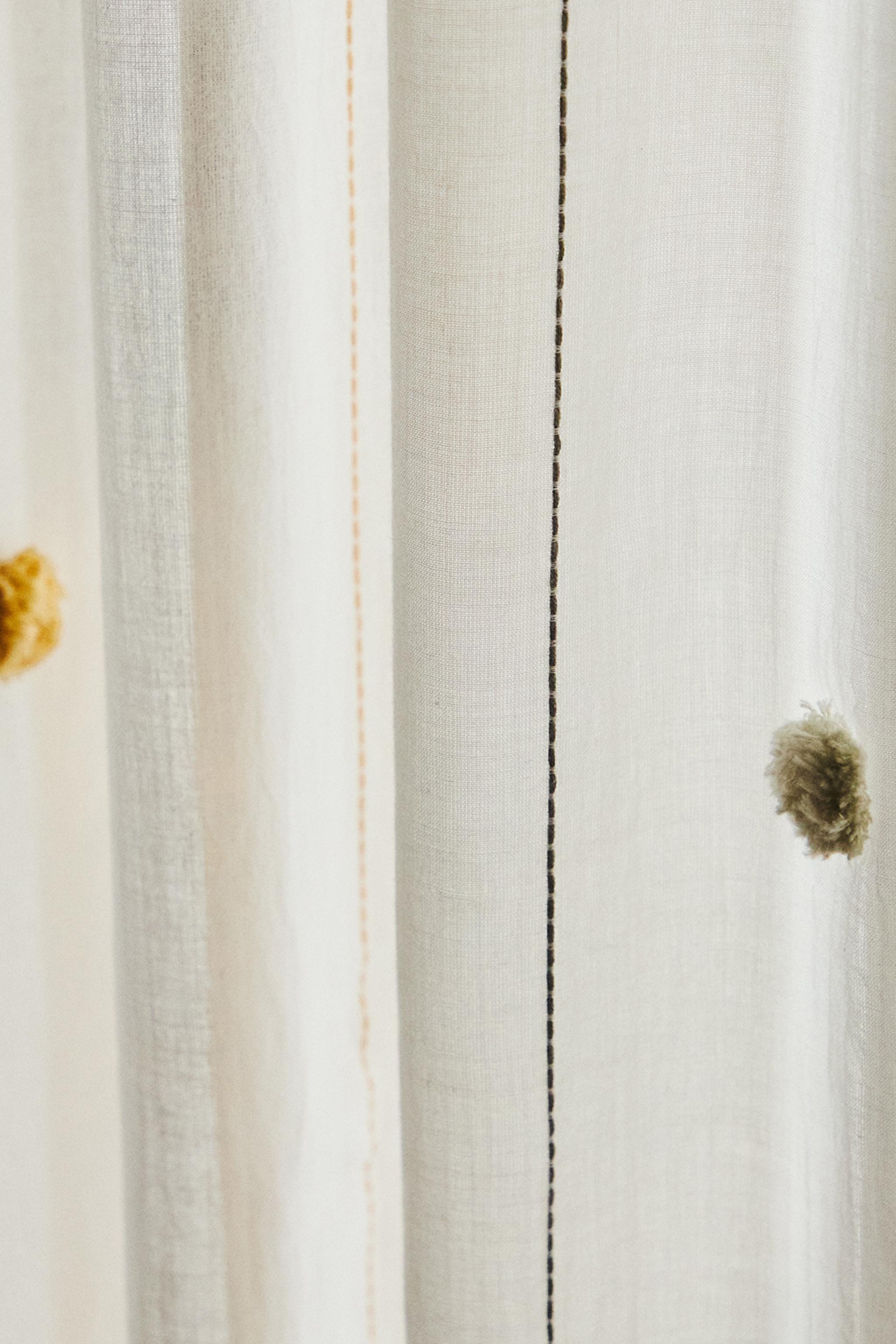 LOW OPACITY TASSEL CURTAIN