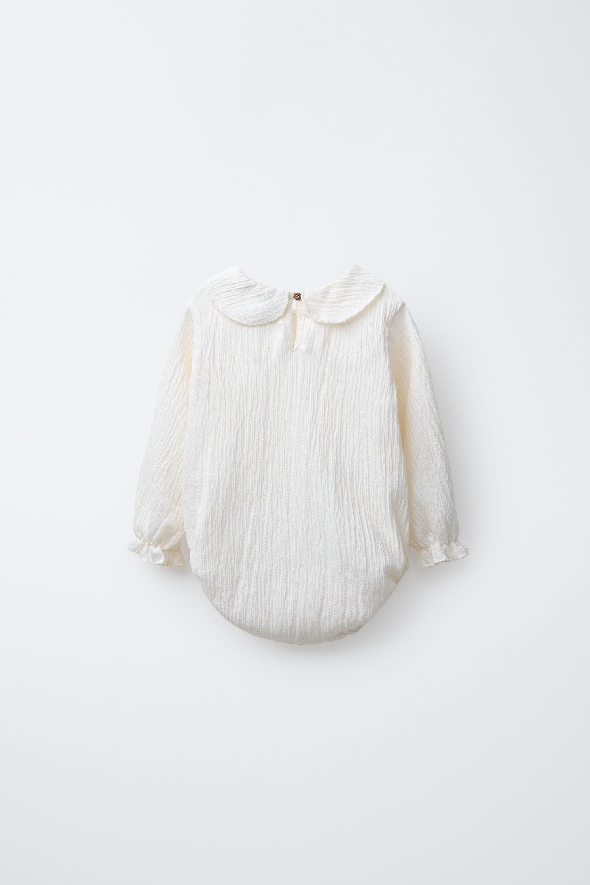 TEXTURED NECK BODYSUIT