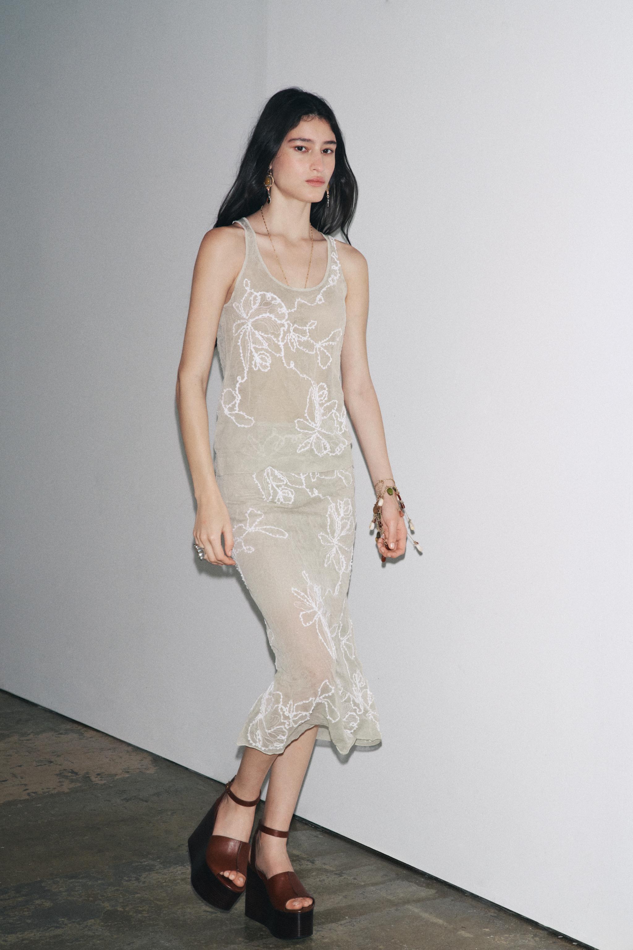 SEMI-SHEER STRUCTURED KNIT SKIRT