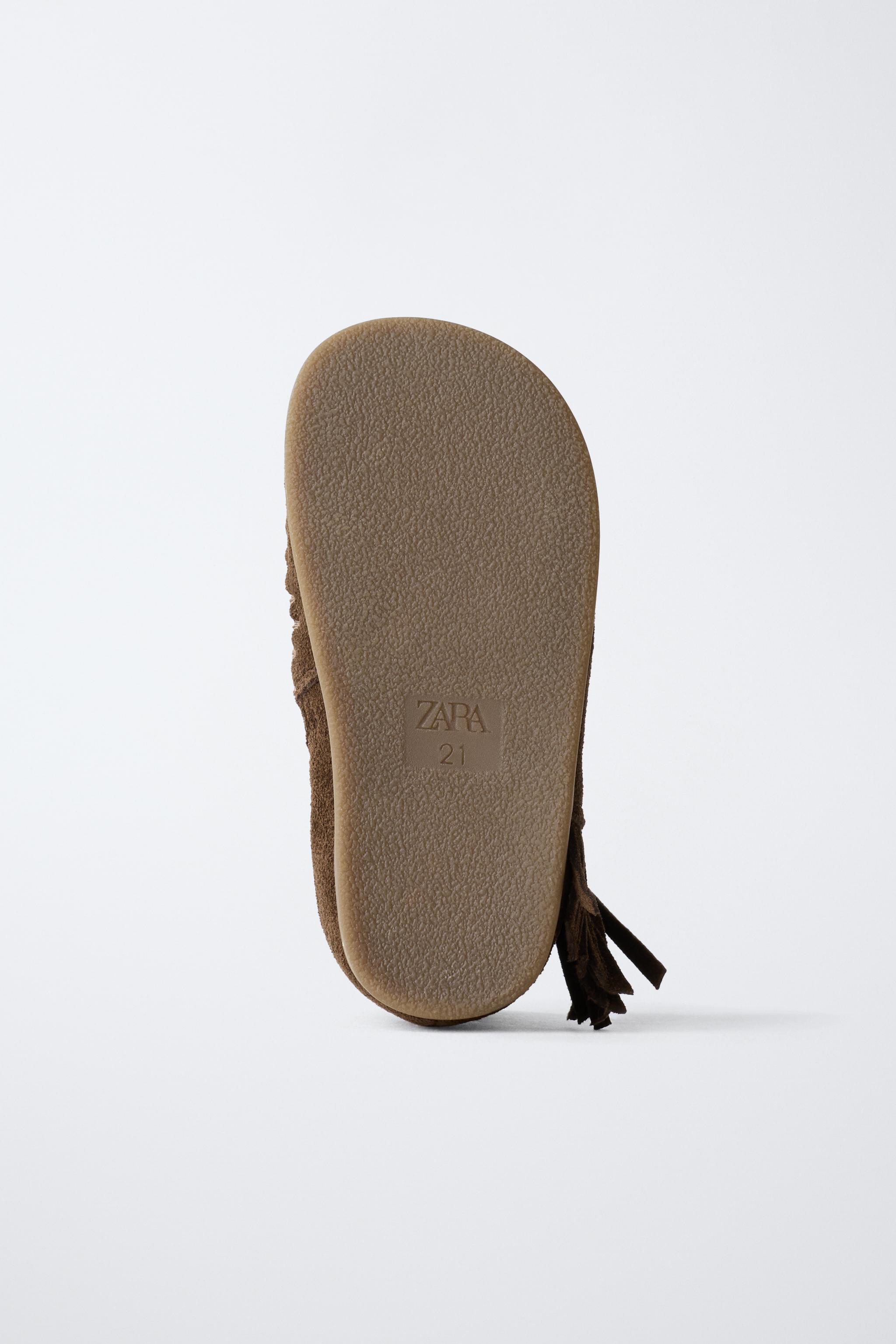 FRINGED LEATHER BOOTS