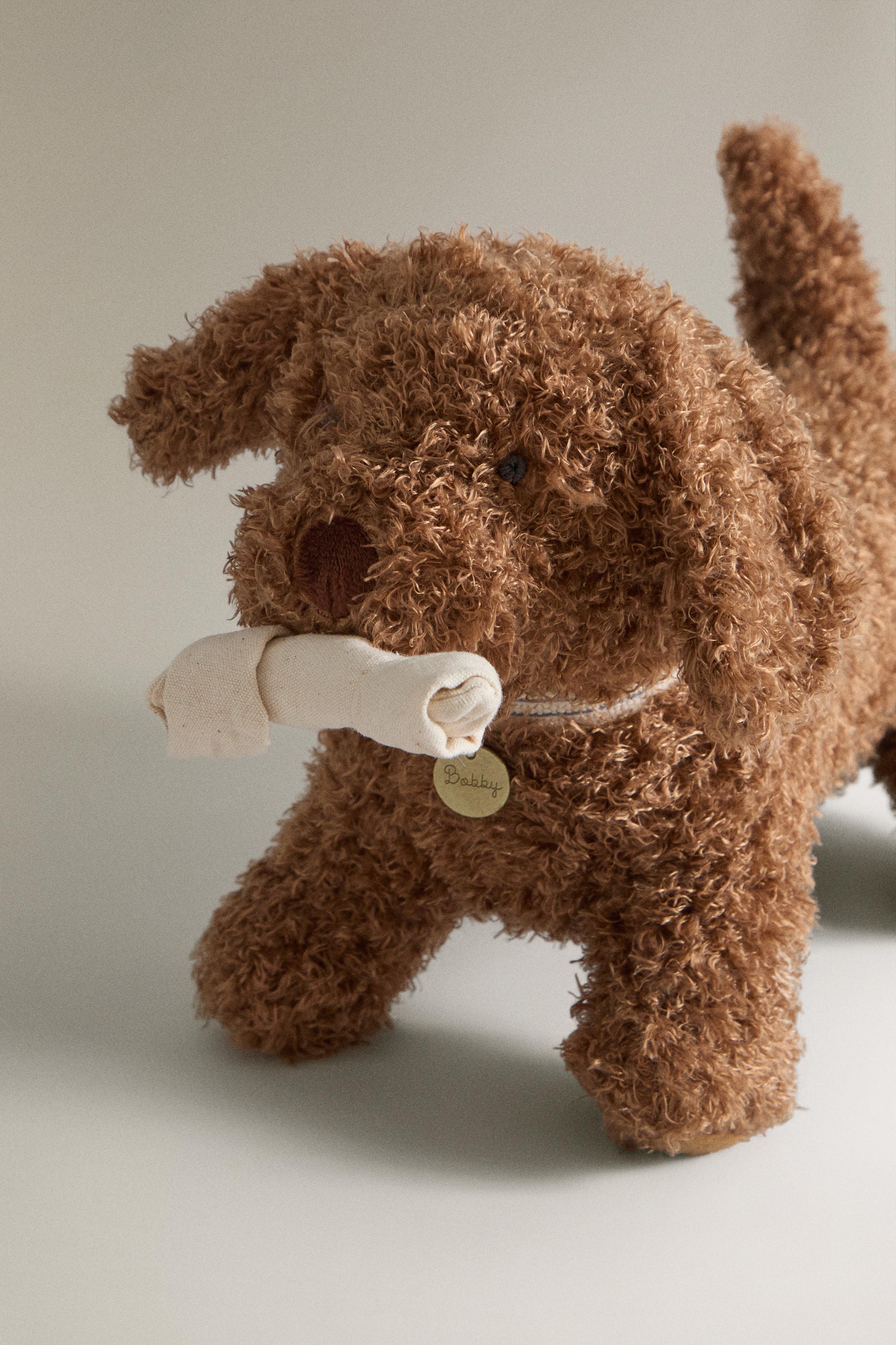 CHILDREN'S PLUSH TOY DOG WITH WHEELS