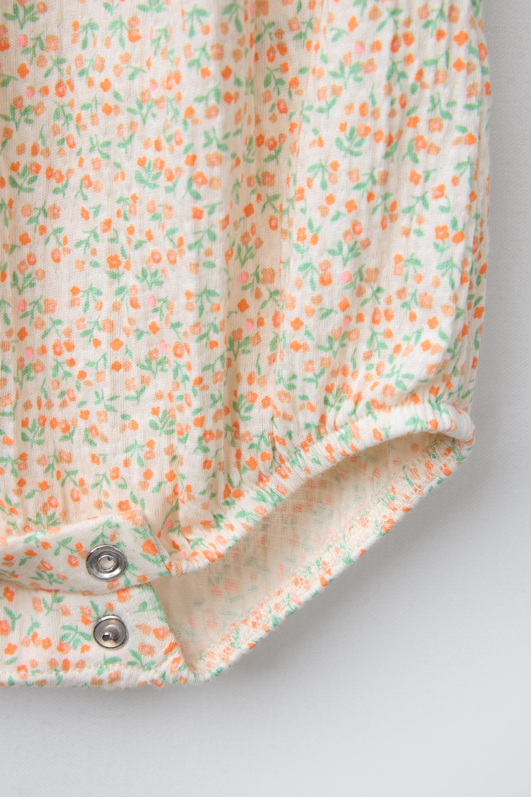 TEXTURED FLORAL BODYSUIT