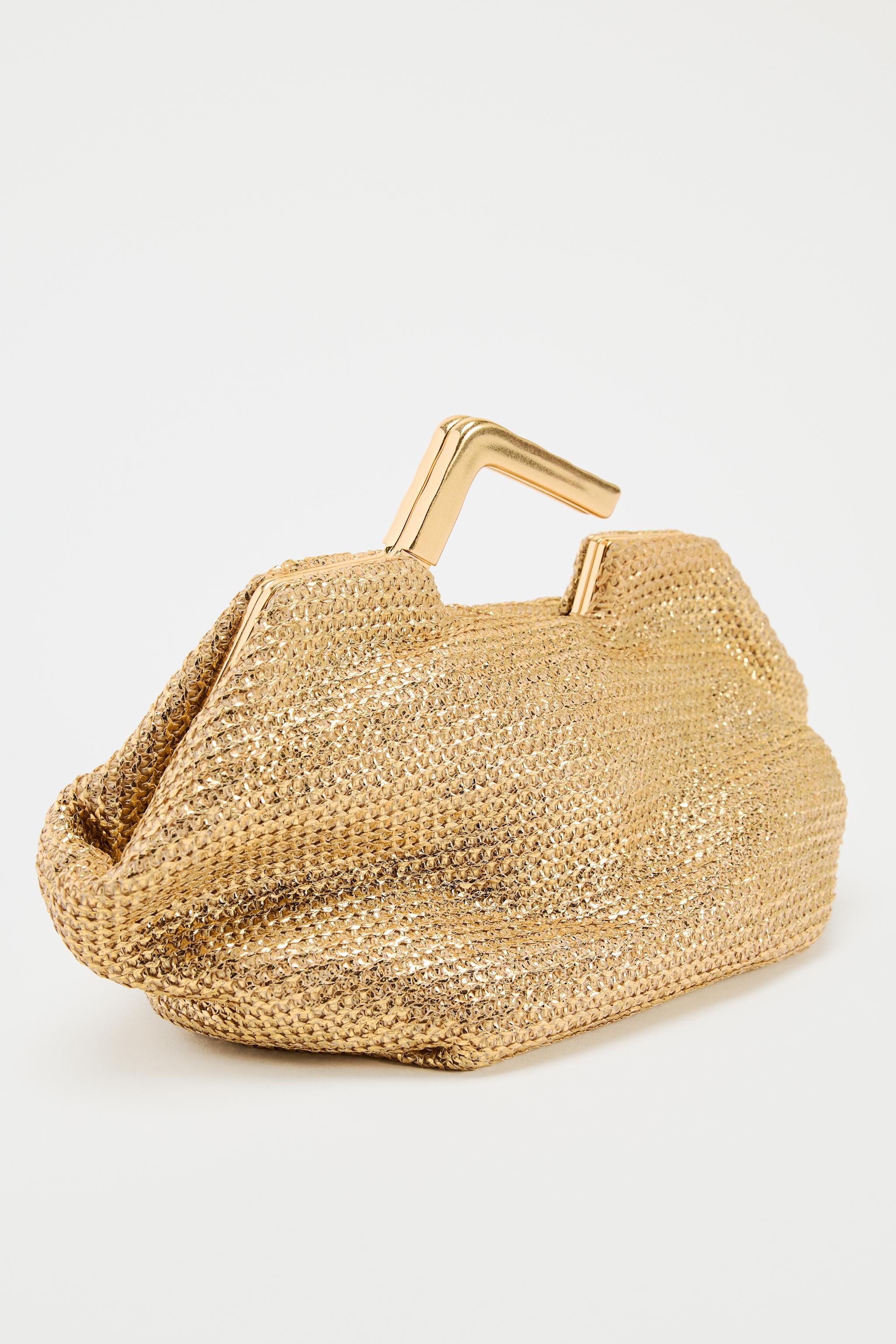 GOLD BAG WITH METAL HANDLE
