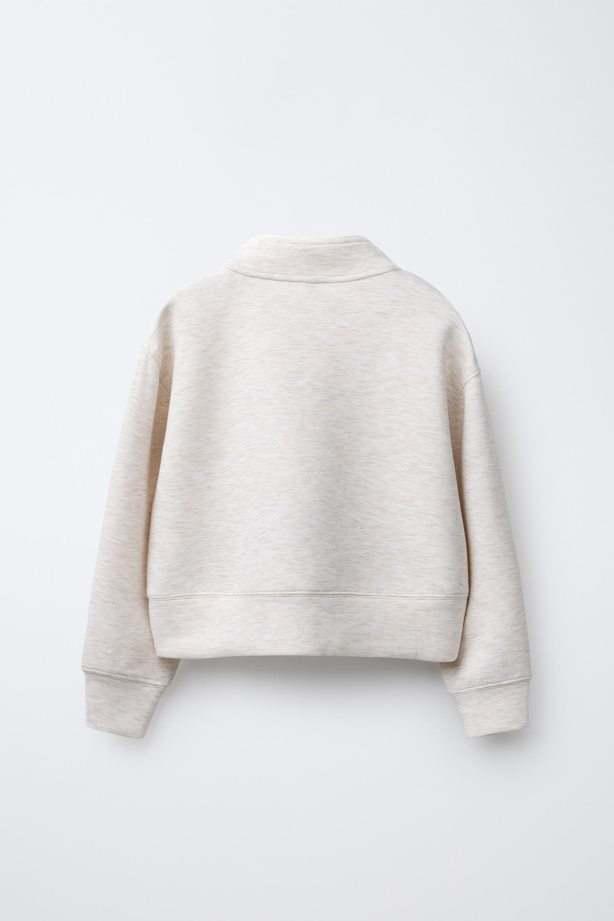 RAISED TEXT SWEATSHIRT