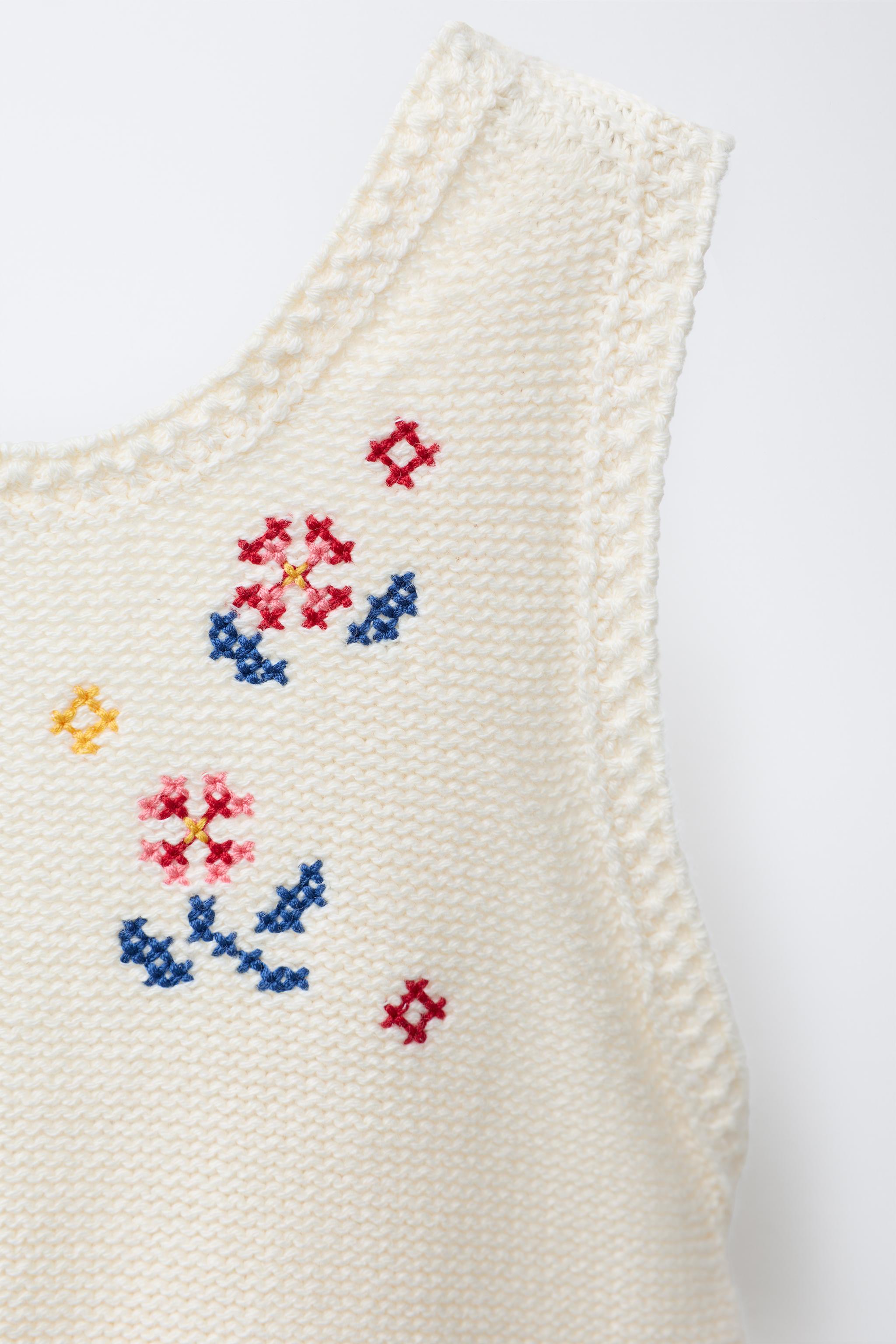 LONG KNIT OVERALLS WITH CROSS-STITCH DETAILS