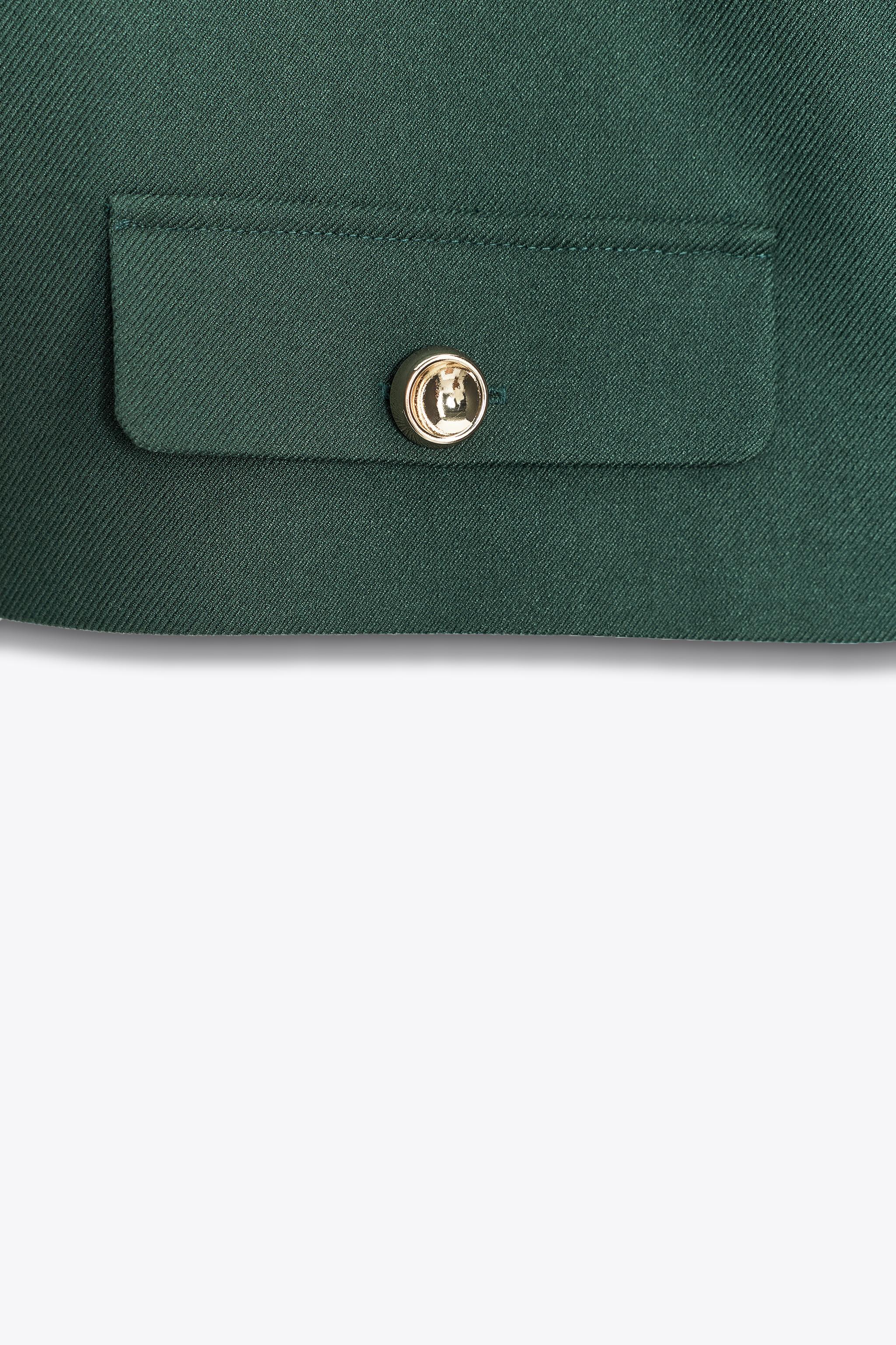 SHORT VEST WITH FLAPS