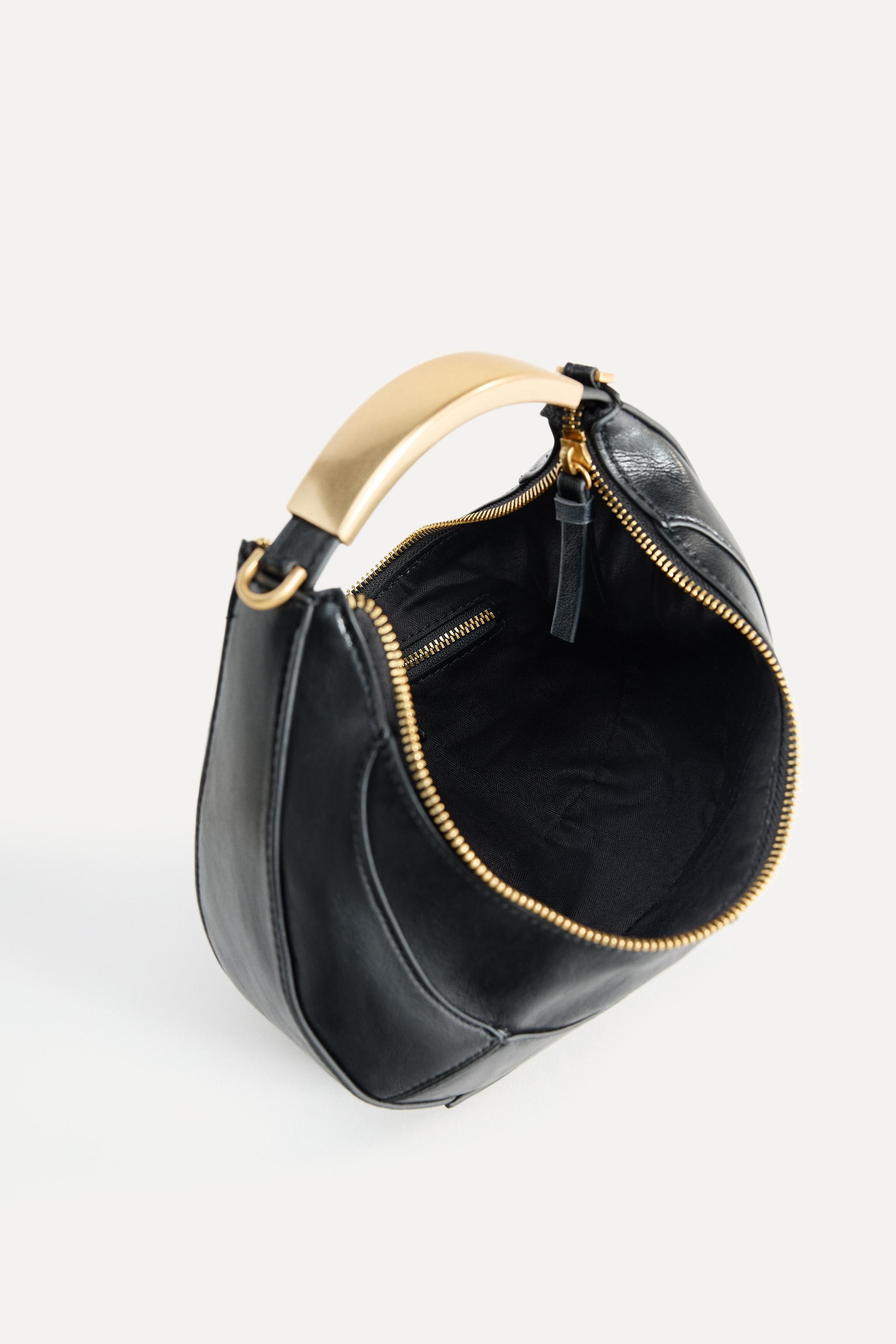 OVAL BAG WITH METAL HANDLE