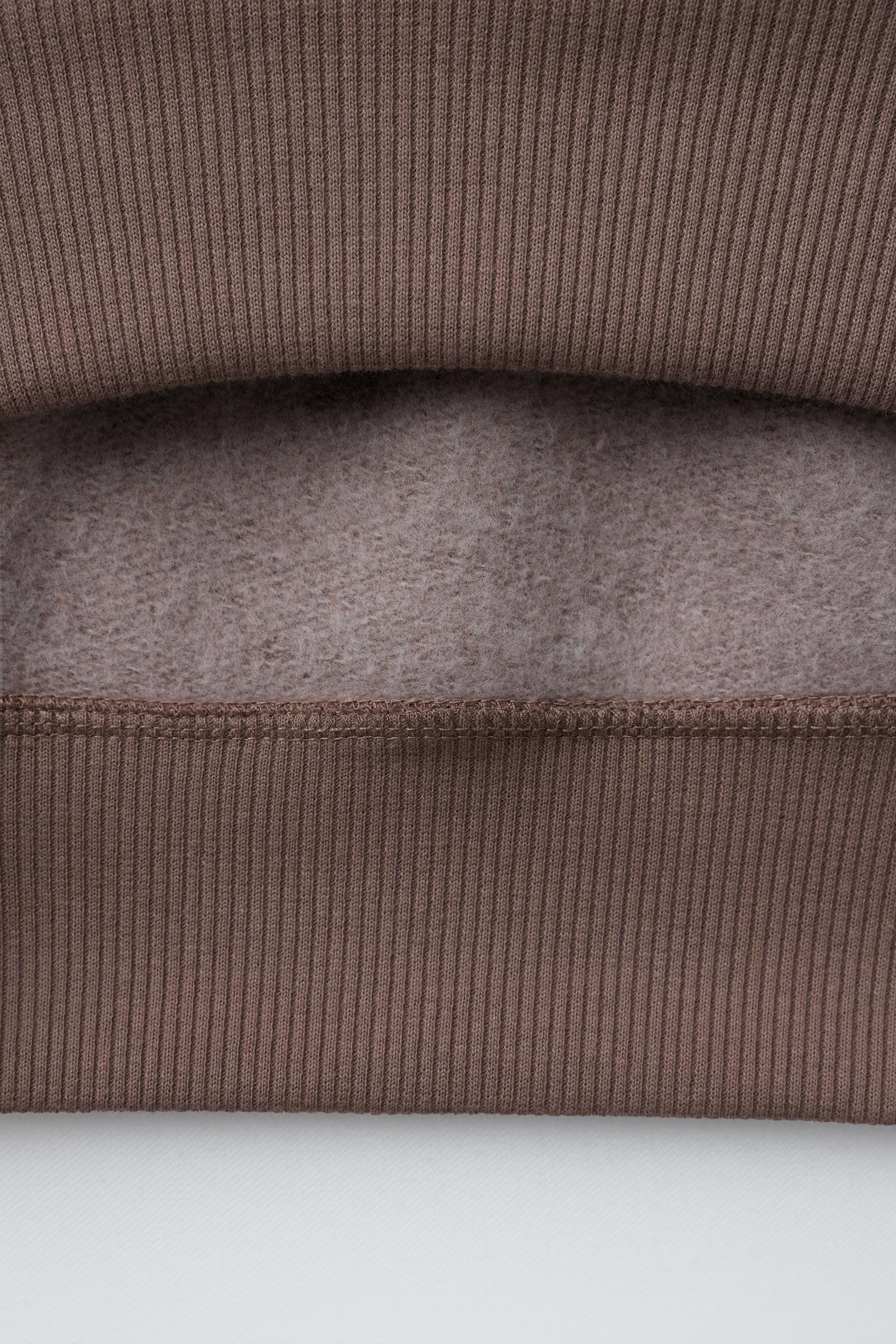 CINNAMOROLL © SANRIO FLOCKED PRINT SWEATSHIRT