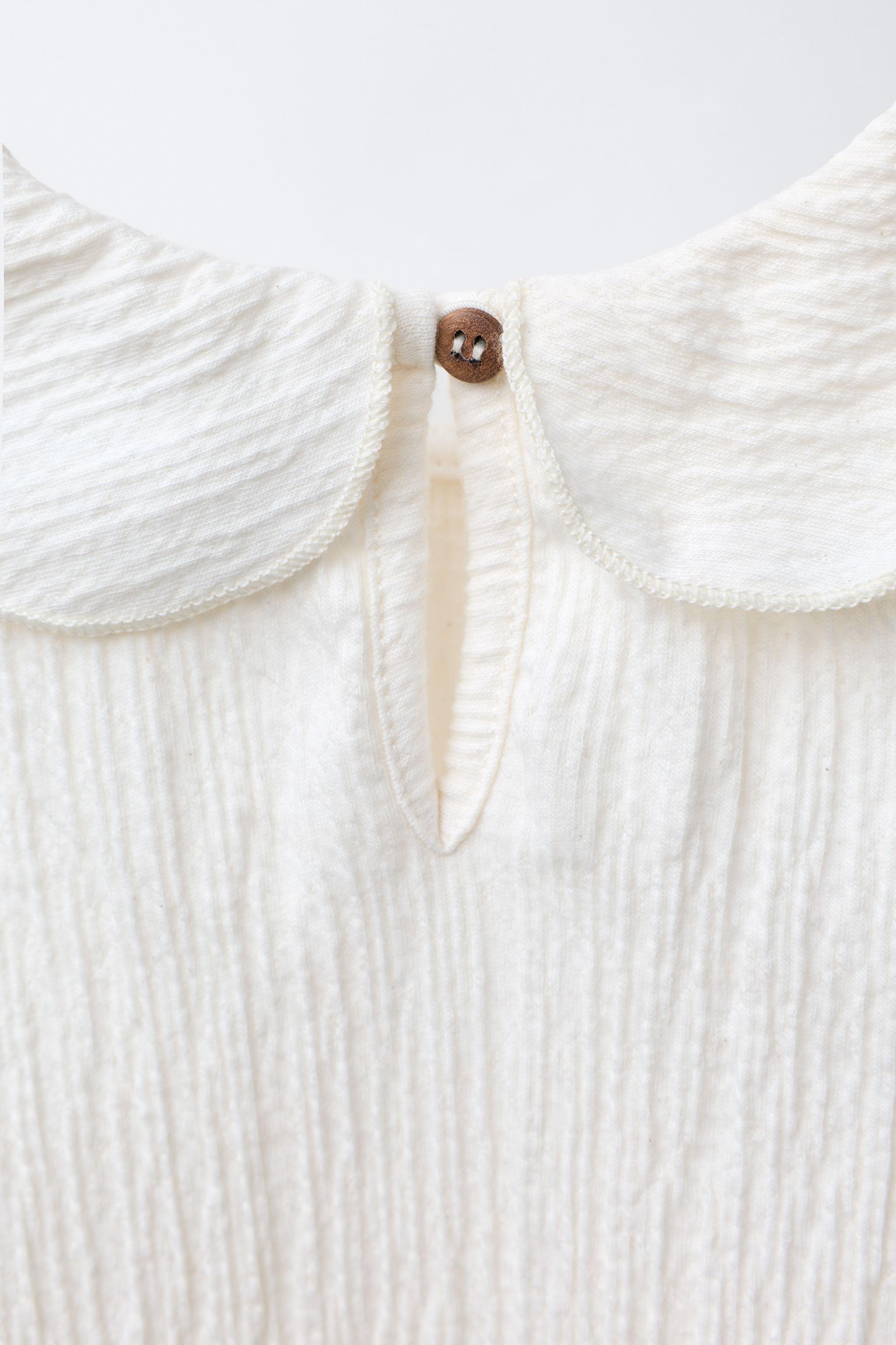 TEXTURED NECK BODYSUIT