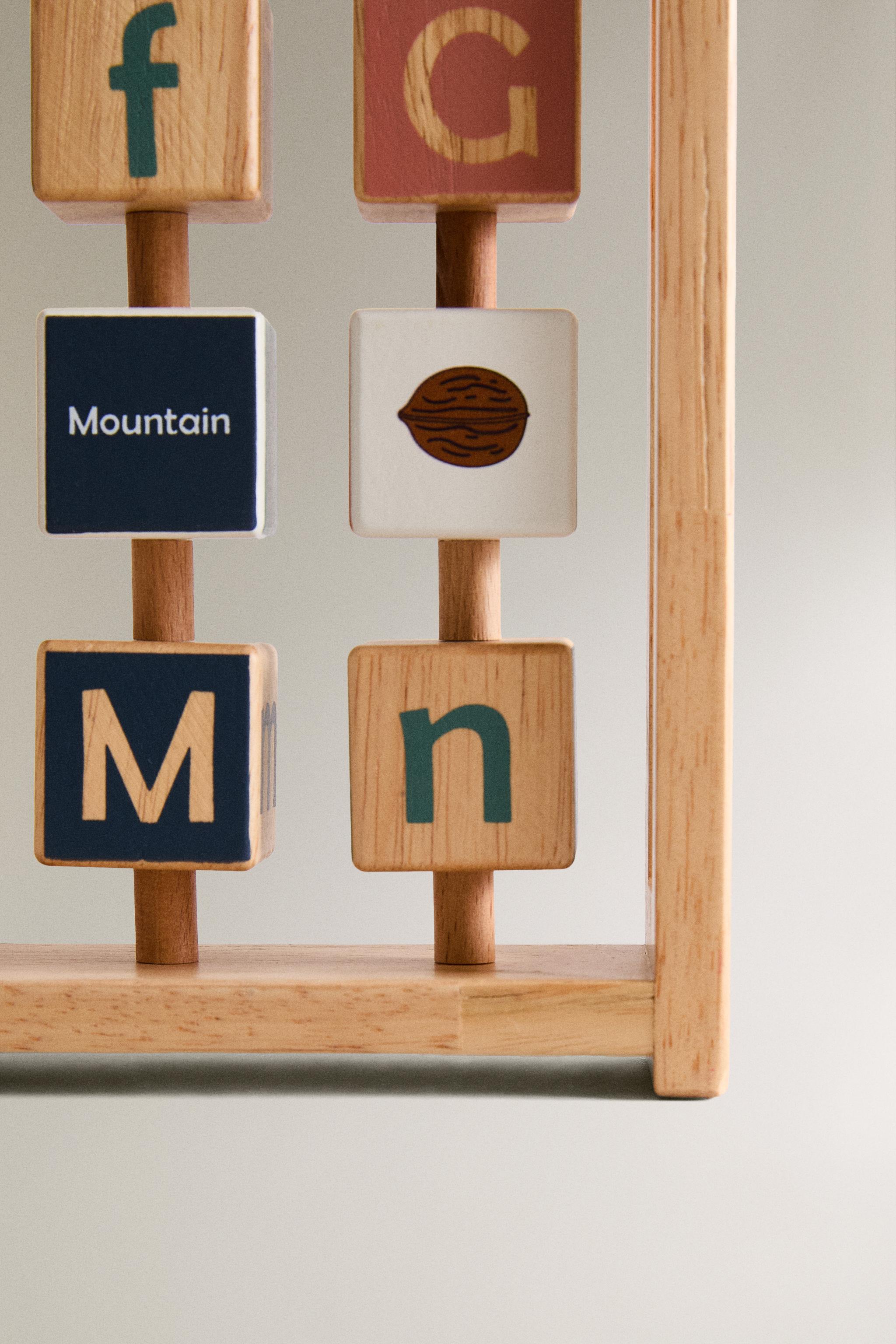 CHILDREN’S WOODEN ALPHABET TOY