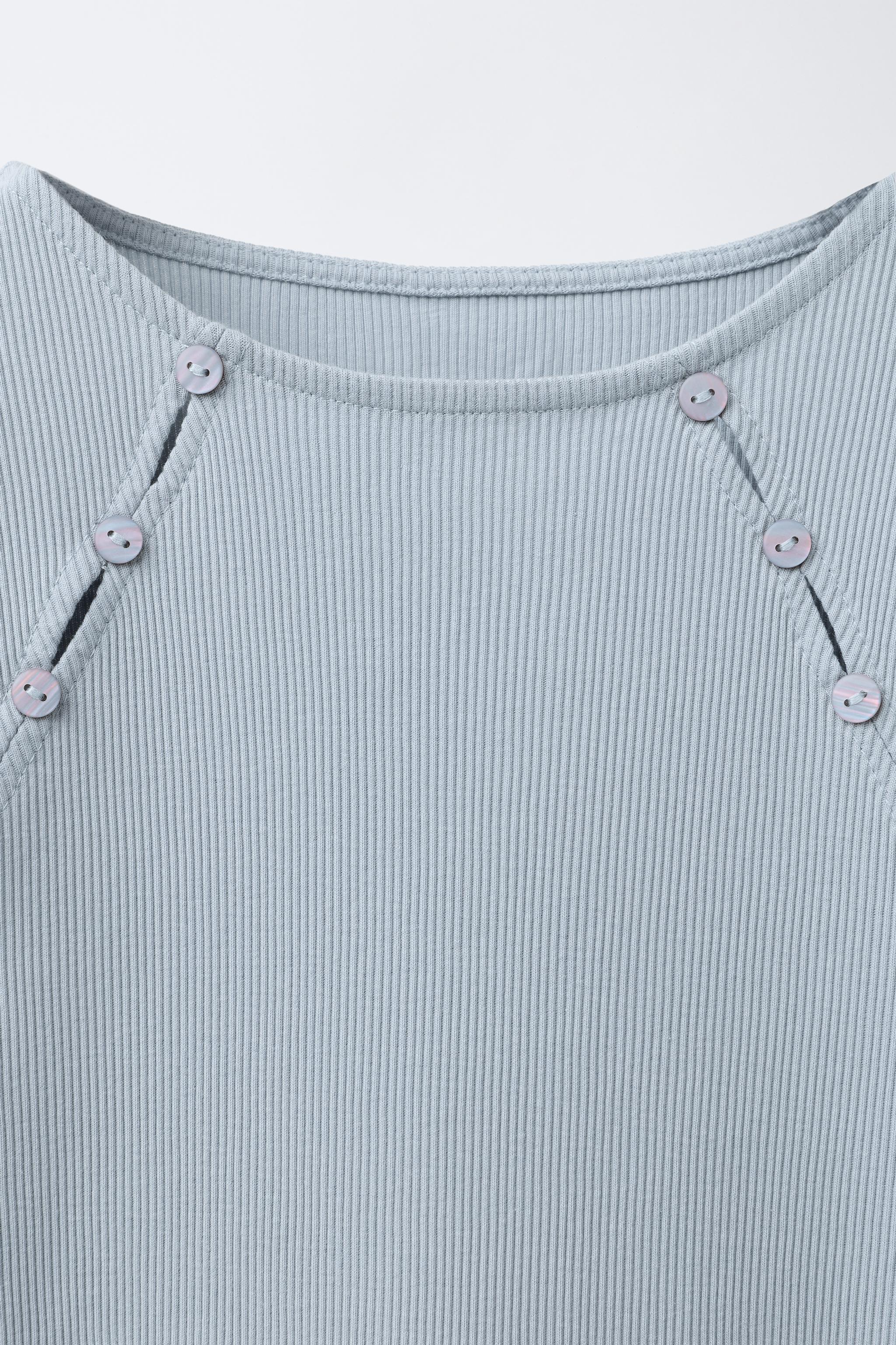 RIBBED T-SHIRT WITH BUTTONS AND CUT-OUT