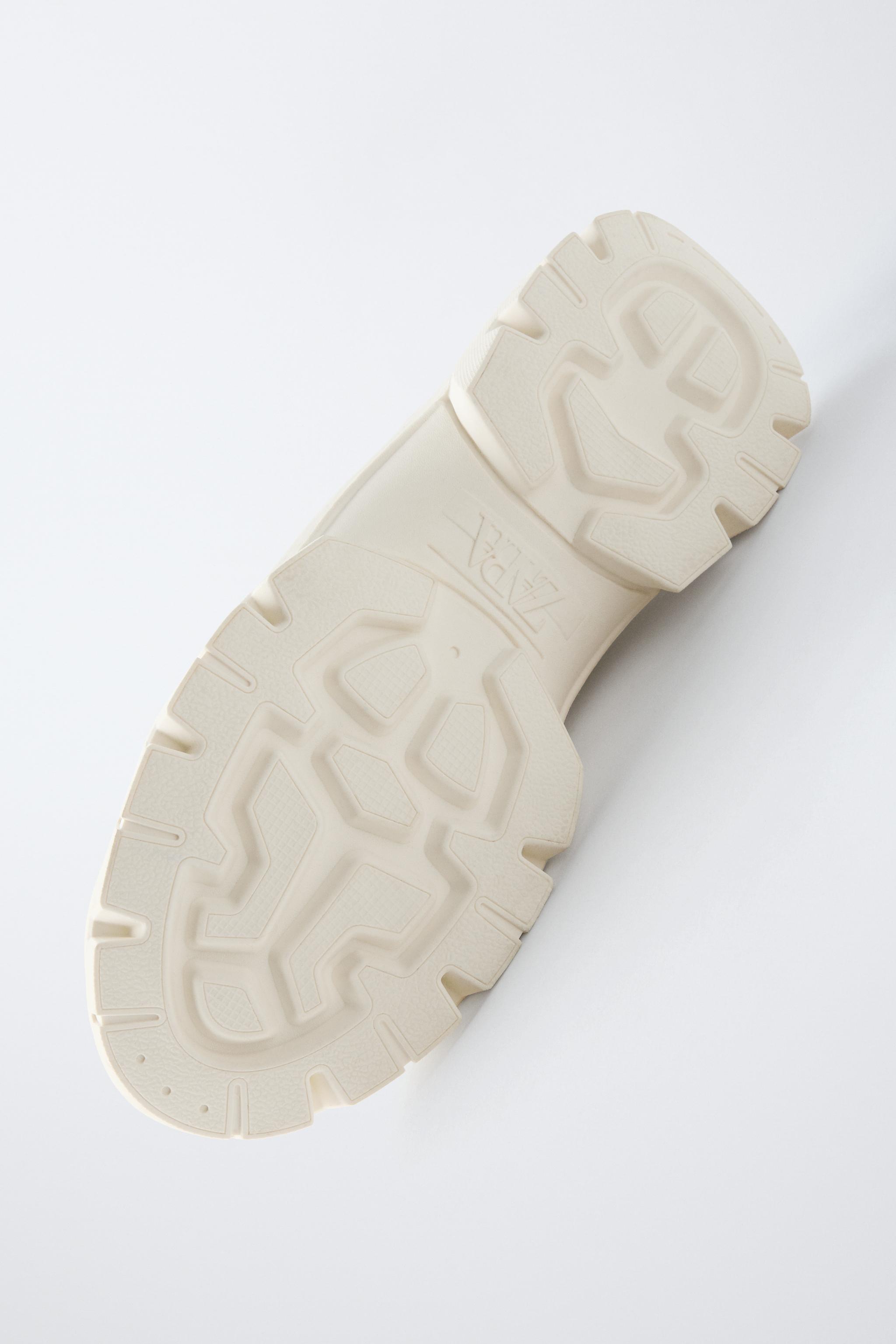 THICK-SOLED SNEAKERS WITH CHARMS