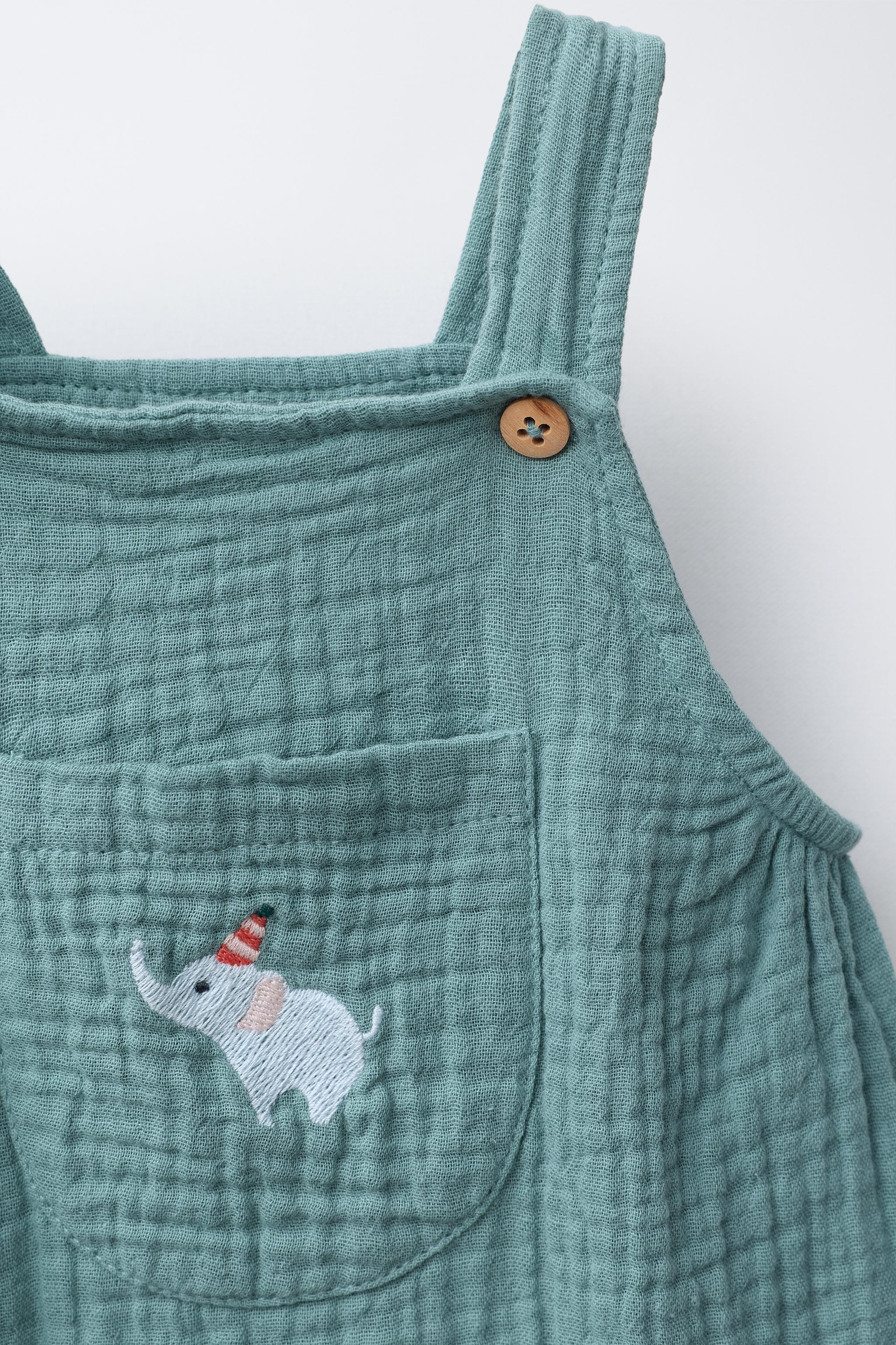 TEXTURED JUMPSUIT WITH ELEPHANT EMBROIDERY