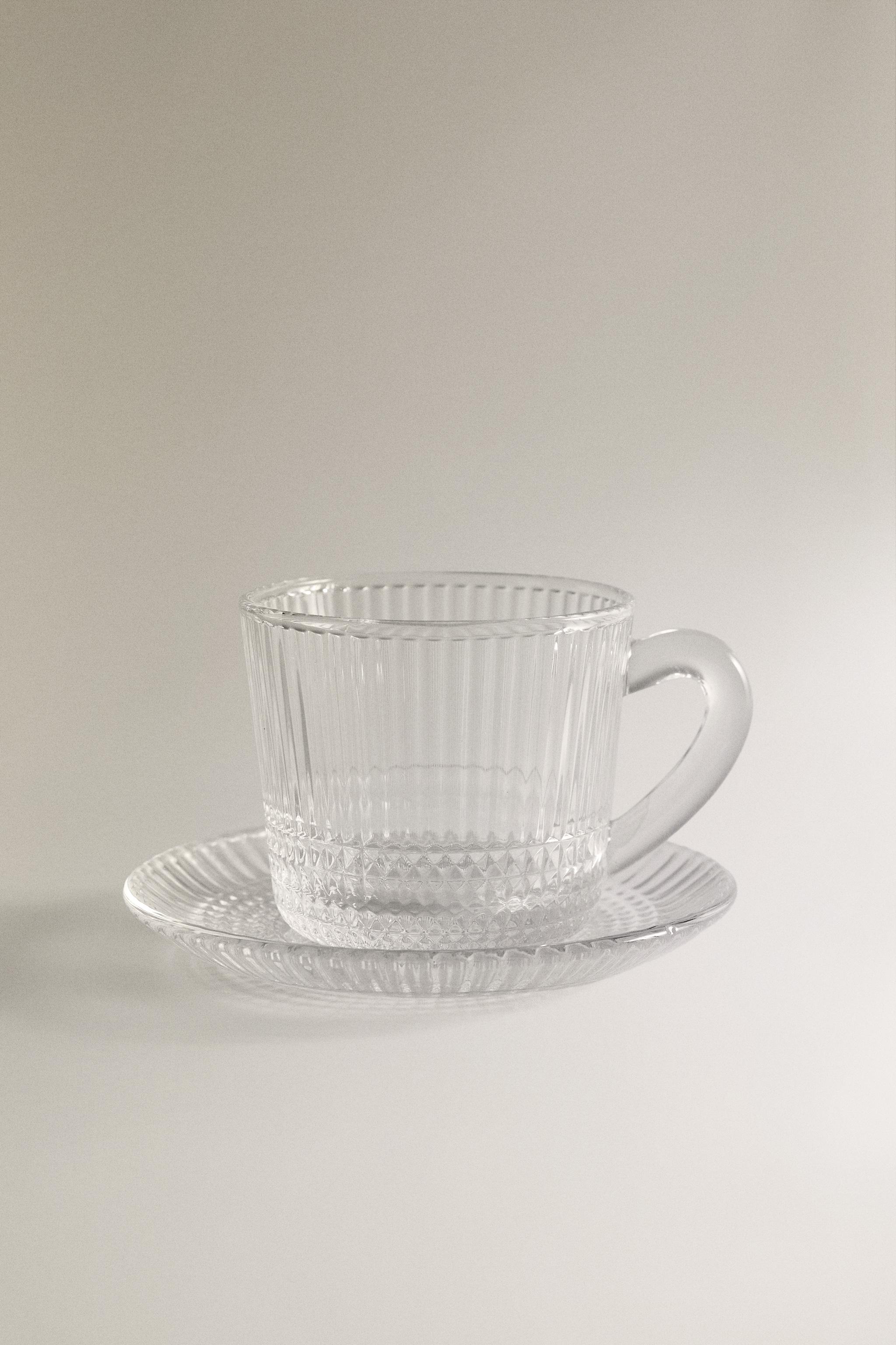COFFEE CUP AND SAUCER WITH RAISED GEOMETRIC DESIGN