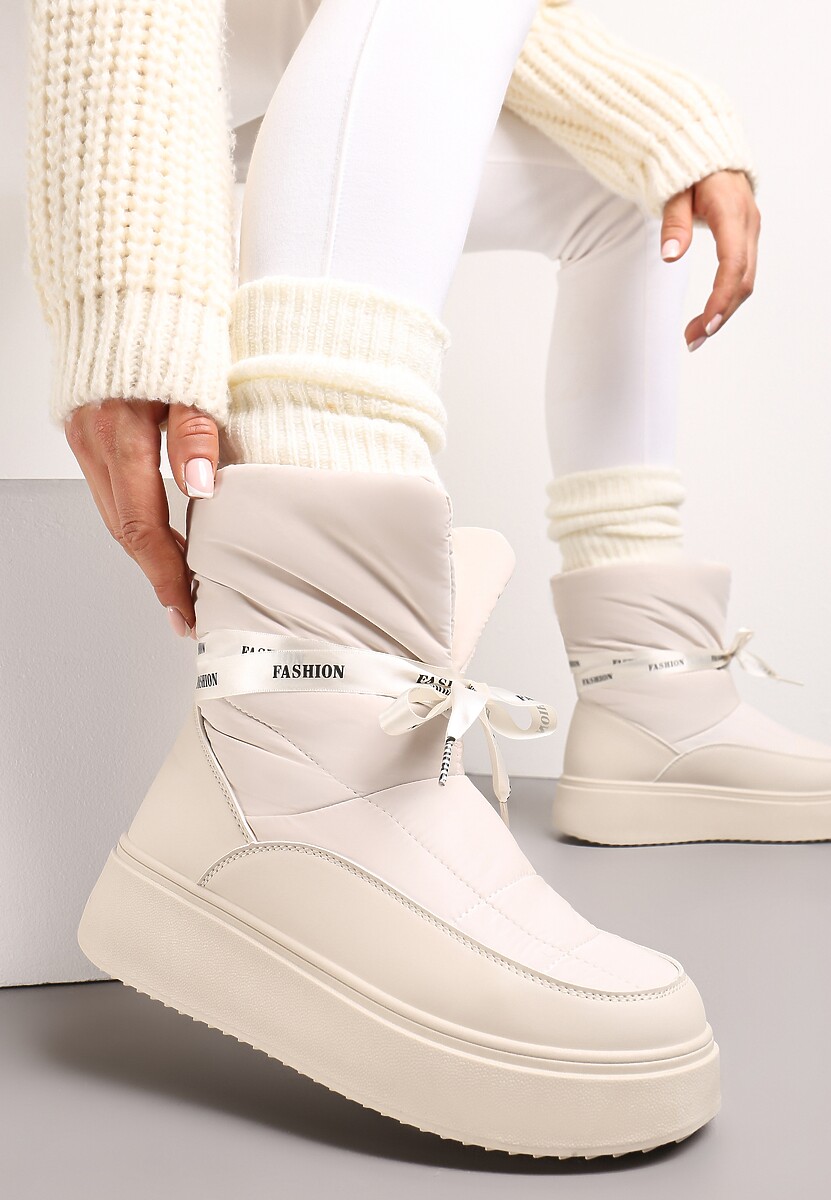 Beżowe Śniegowce z Ozdobną Wstążką Wokół Kostki Rohessi