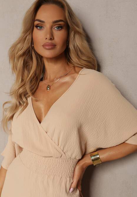 Beżowy Kombinezon o Kopertowym Fasonie z Szerokim Luźnym Dołem i Kieszeniami Octoni
