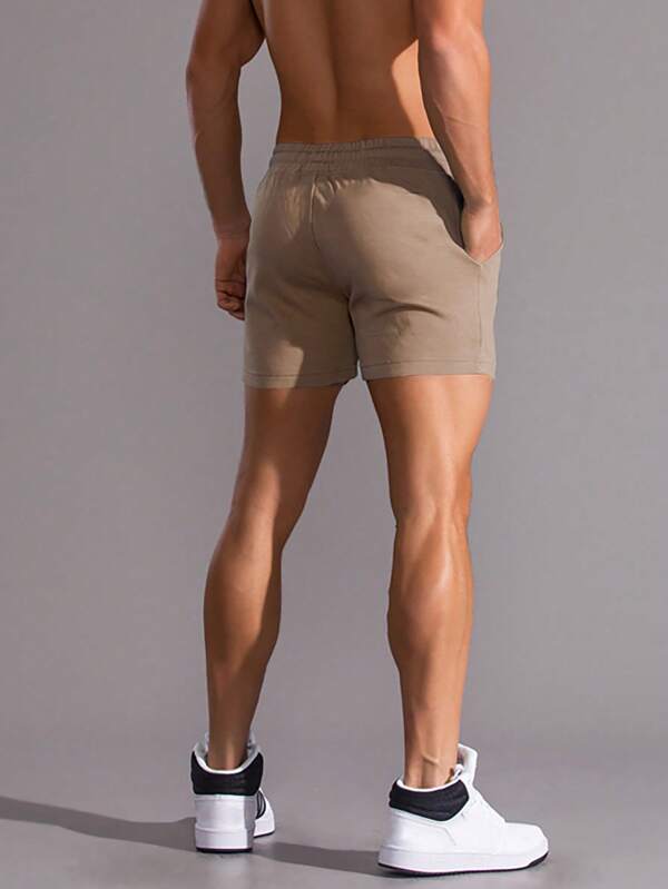 Men Solid Drawstring Waist Slant Pocket Shorts