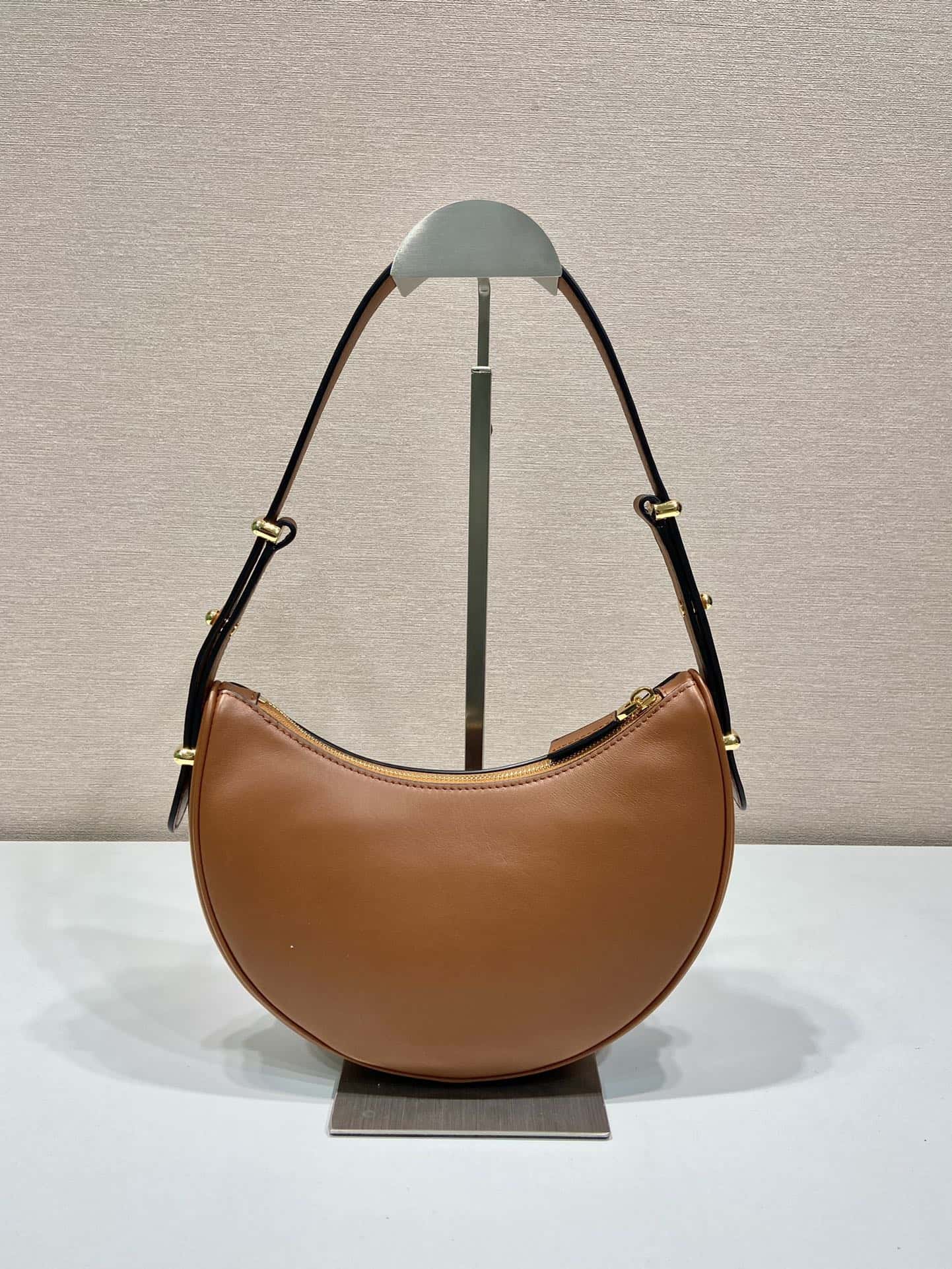 Cowhide Moon handbag with shoulder strap