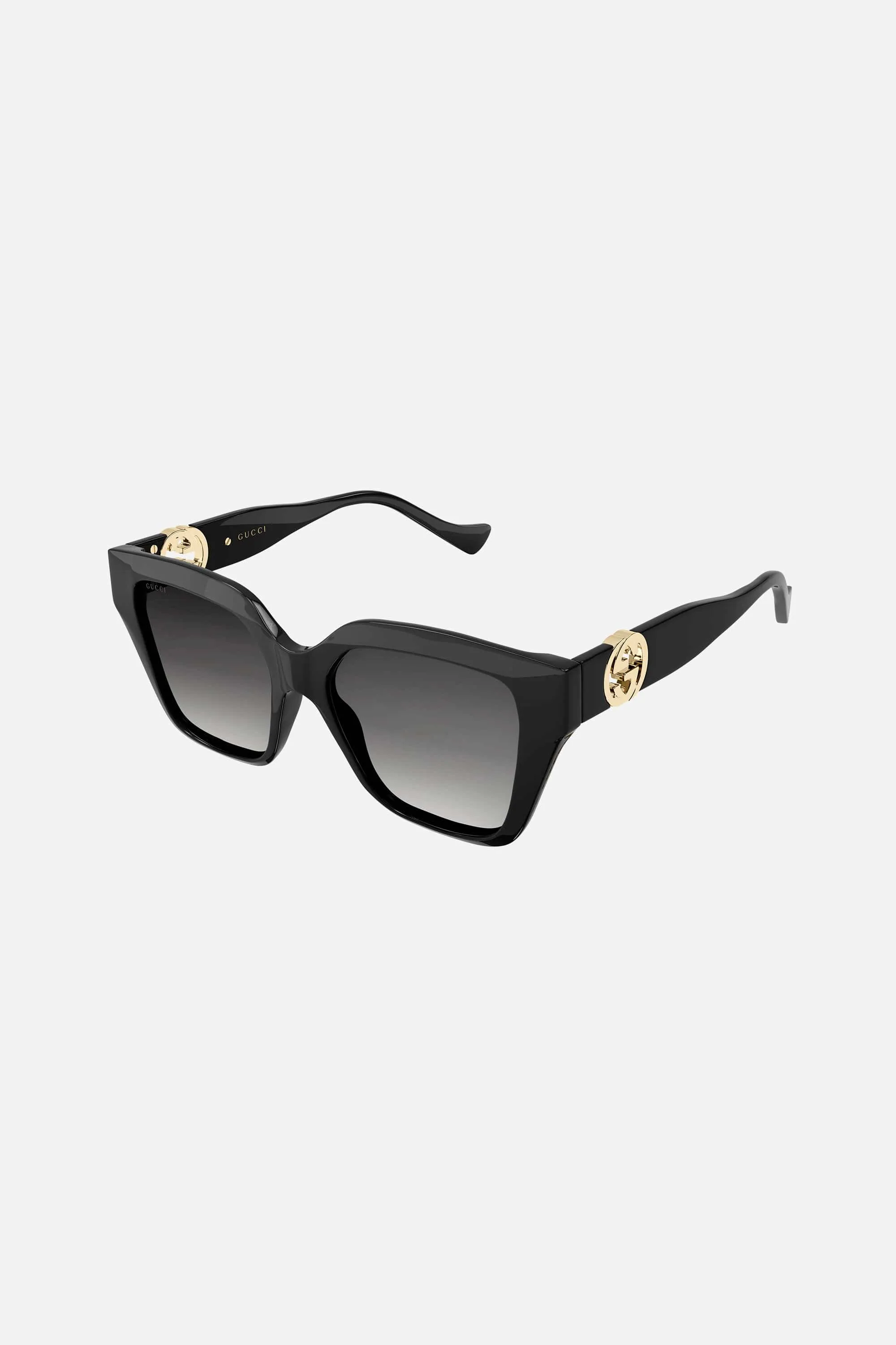 Gucci cat-eye black sunglasses with integrated GG logo