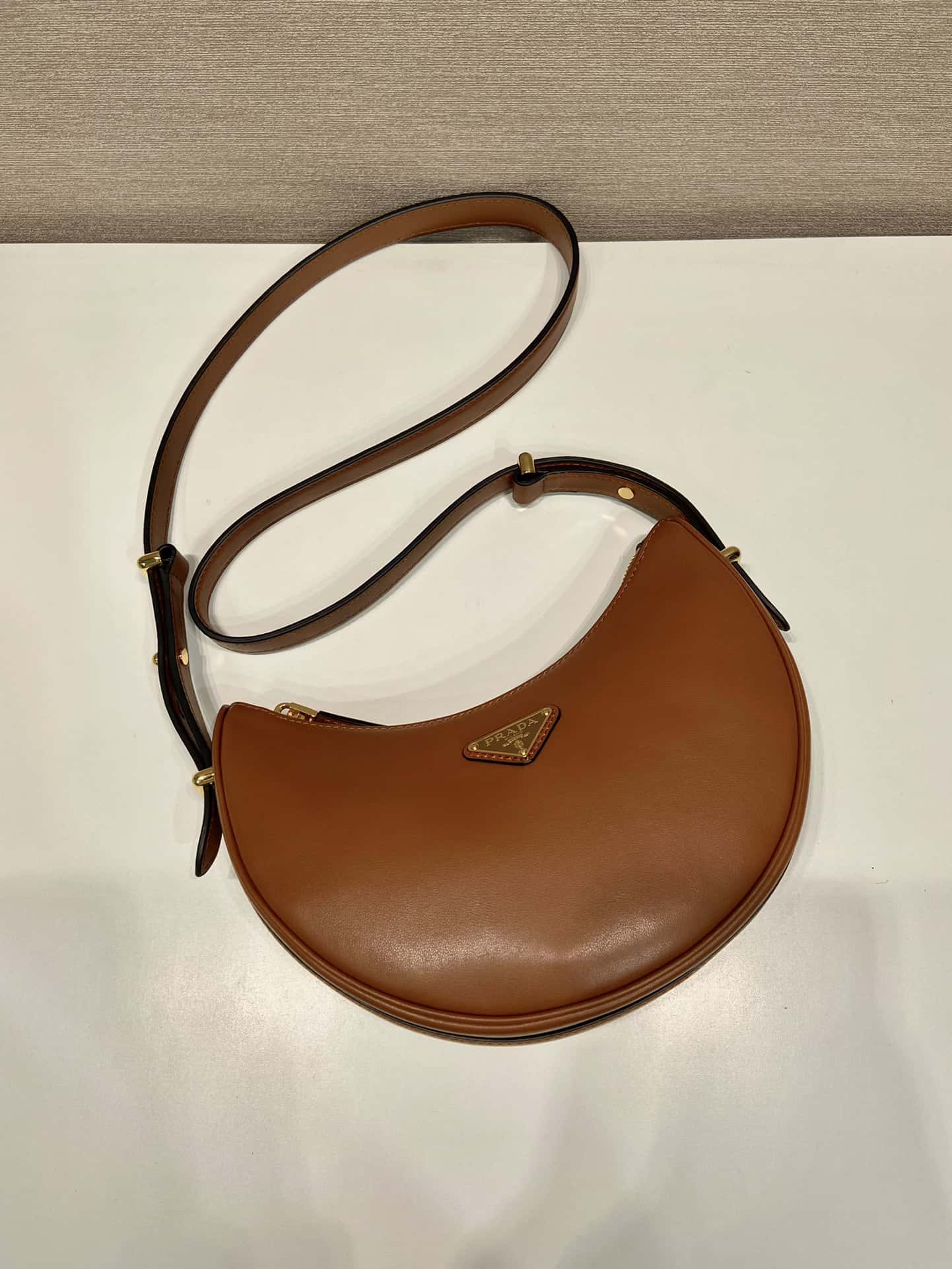 Cowhide Moon handbag with shoulder strap