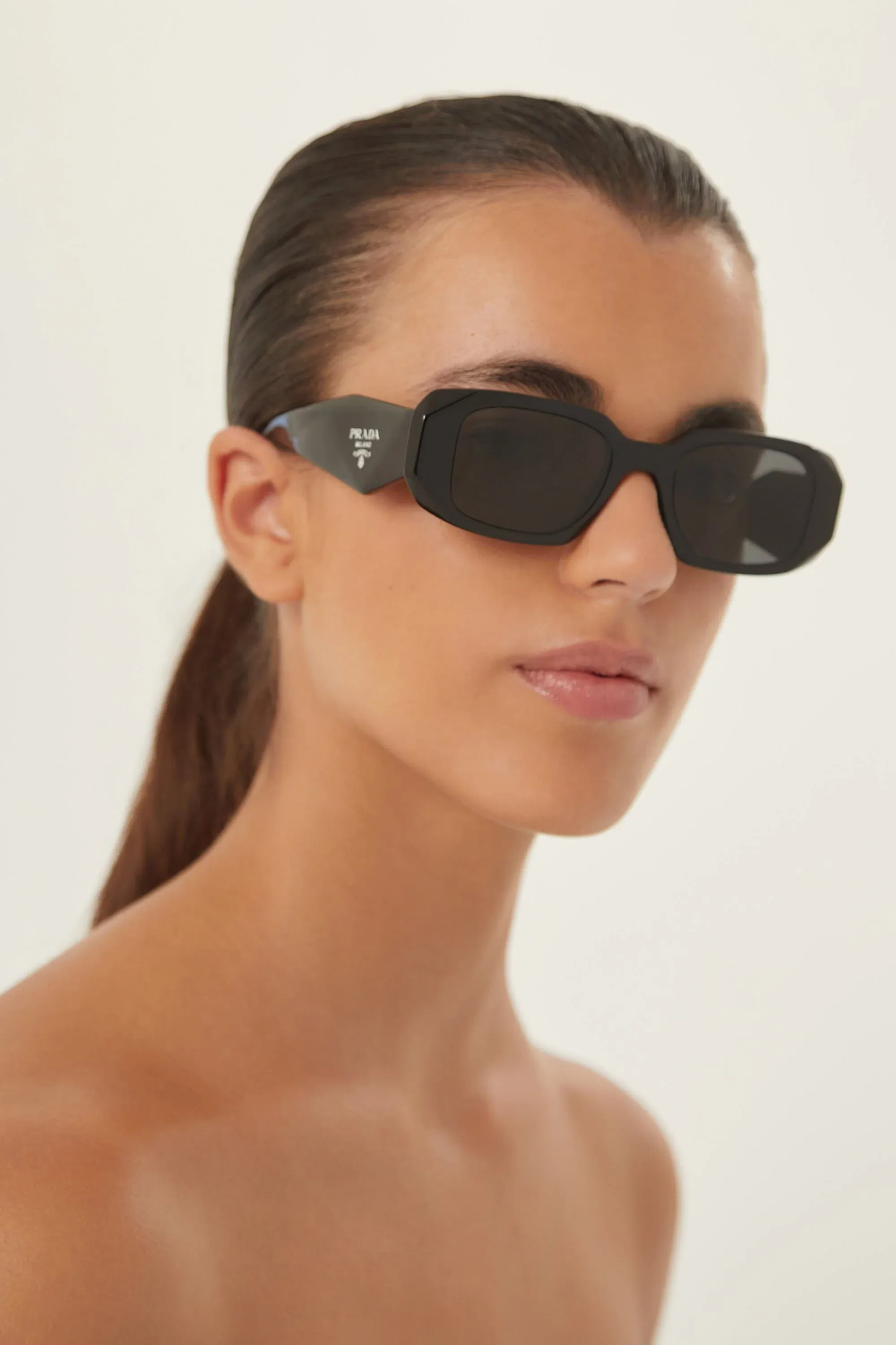 Prada symbol black oval sunglasses