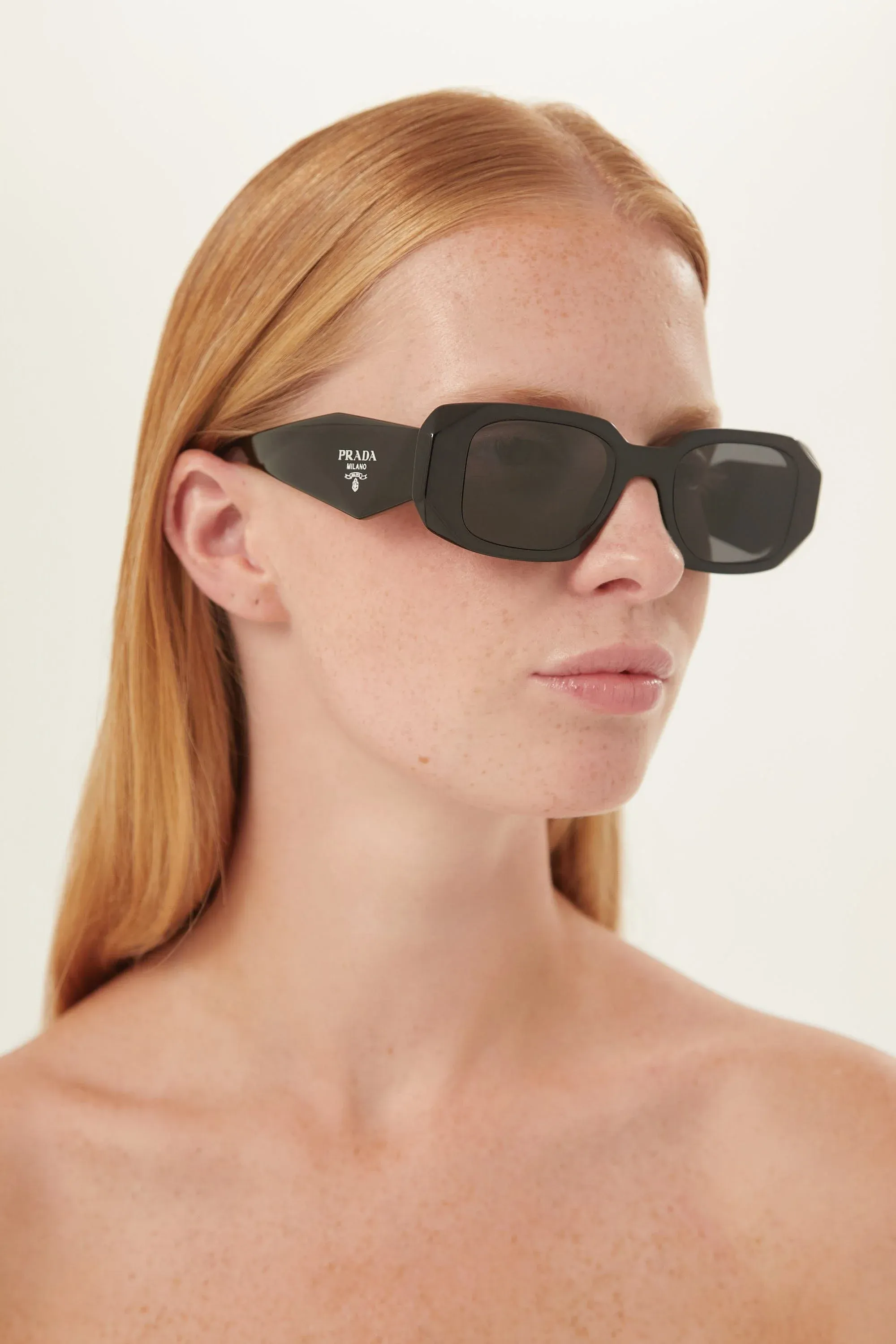 Prada symbol black oval sunglasses