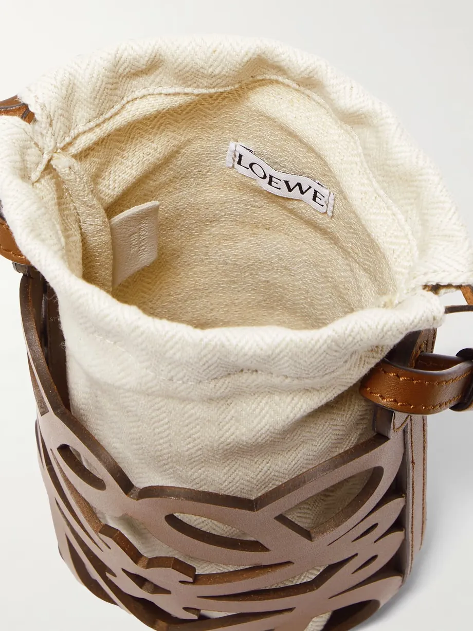 + Paula's Ibiza cutout leather and herringbone canvas shoulder bag