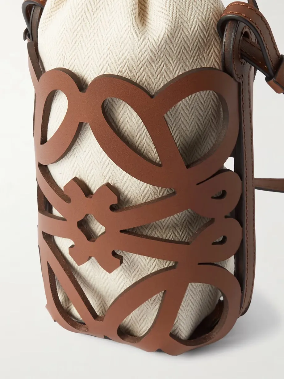 + Paula's Ibiza cutout leather and herringbone canvas shoulder bag