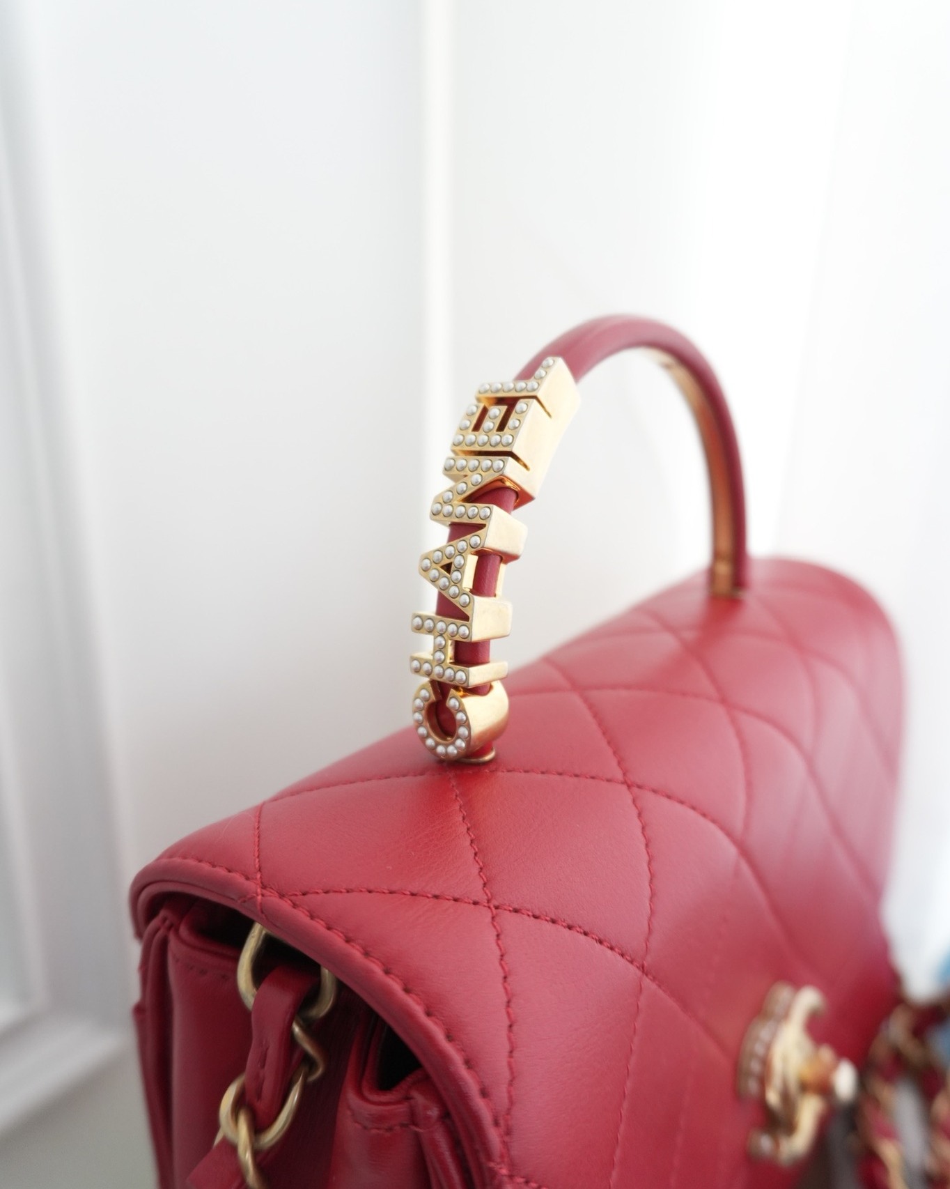 Chanel Quilted Flap Bag with Pearl Logo Top Handle Red Lambskin Aged