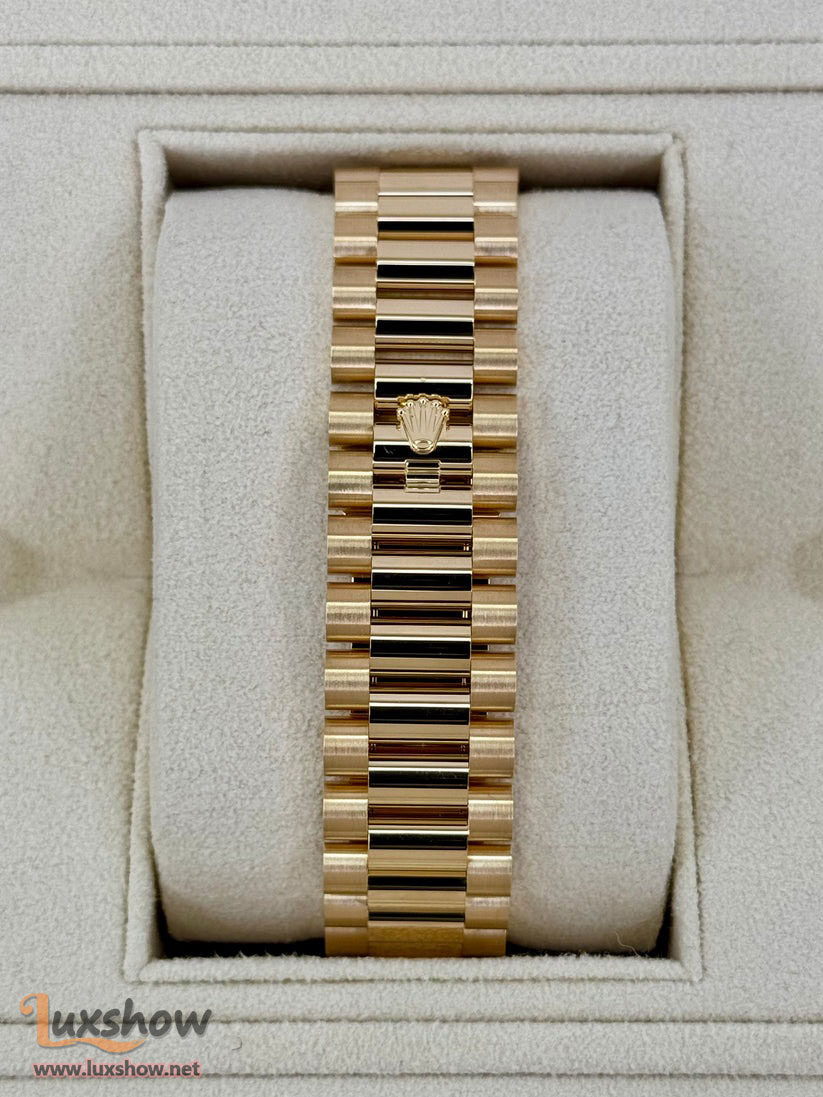 Rolex Day-Date 40mm 228348RBR Presidential Bracelet 18k Yellow Gold with Diamond Set Bezel and Diamond-Paved Dial with 10 baguette-cut diamond hour markers