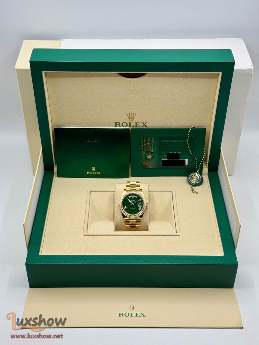 Rolex Day-Date 40mm 228398TBR 18 kt Yellow Gold Presidential Bracelet Factory Baguette Diamond-Set Bezel Green Roman Numeral Dial