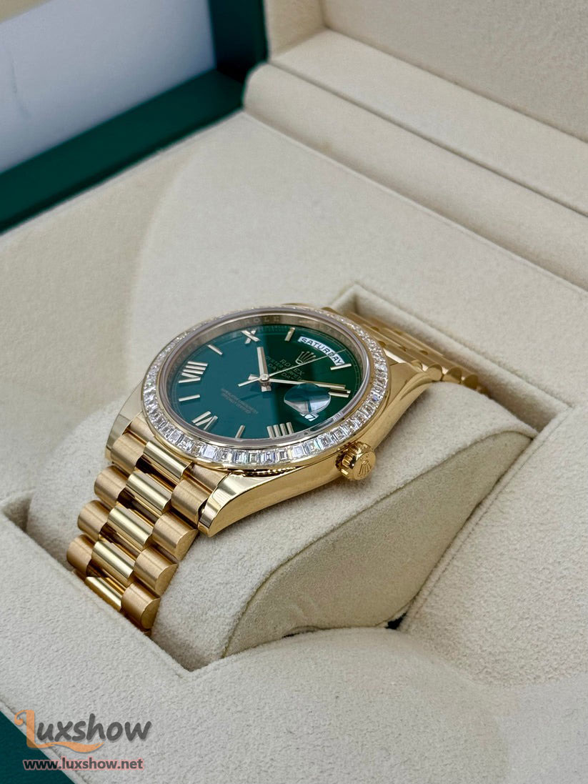 Rolex Day-Date 40mm 228398TBR 18 kt Yellow Gold Presidential Bracelet Factory Baguette Diamond-Set Bezel Green Roman Numeral Dial