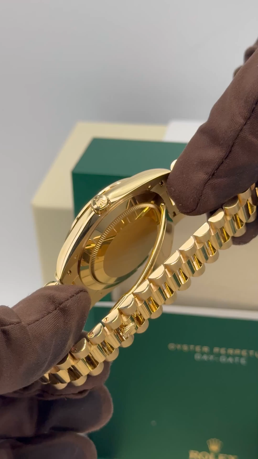Rolex Day-Date 40mm 228398TBR 18 kt Yellow Gold Presidential Bracelet Factory Baguette Diamond-Set Bezel Green Roman Numeral Dial